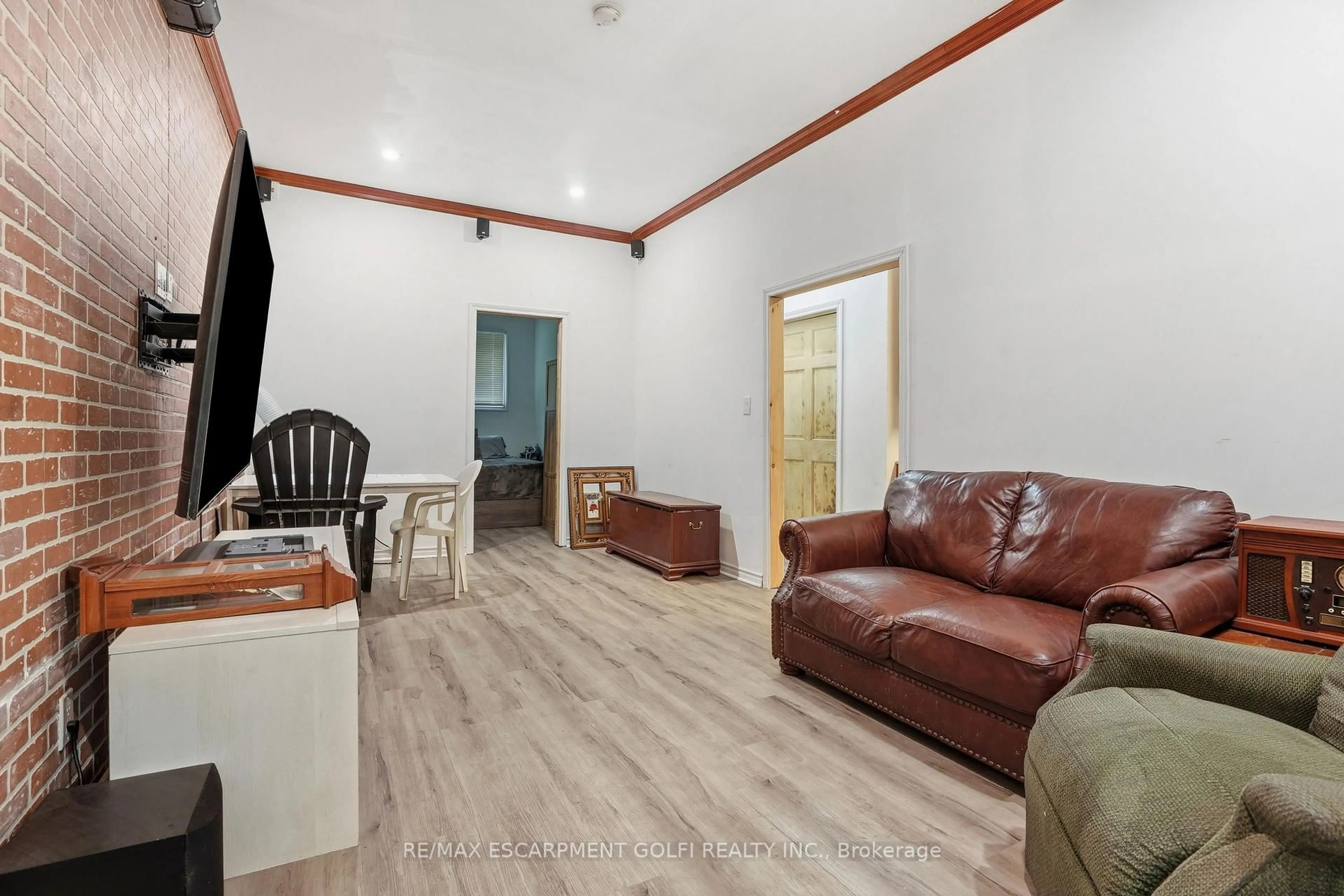 Living room with furniture, wood/laminate floor for 334 Rattle Snake Rd #8, Haldimand Ontario N0A 1K0