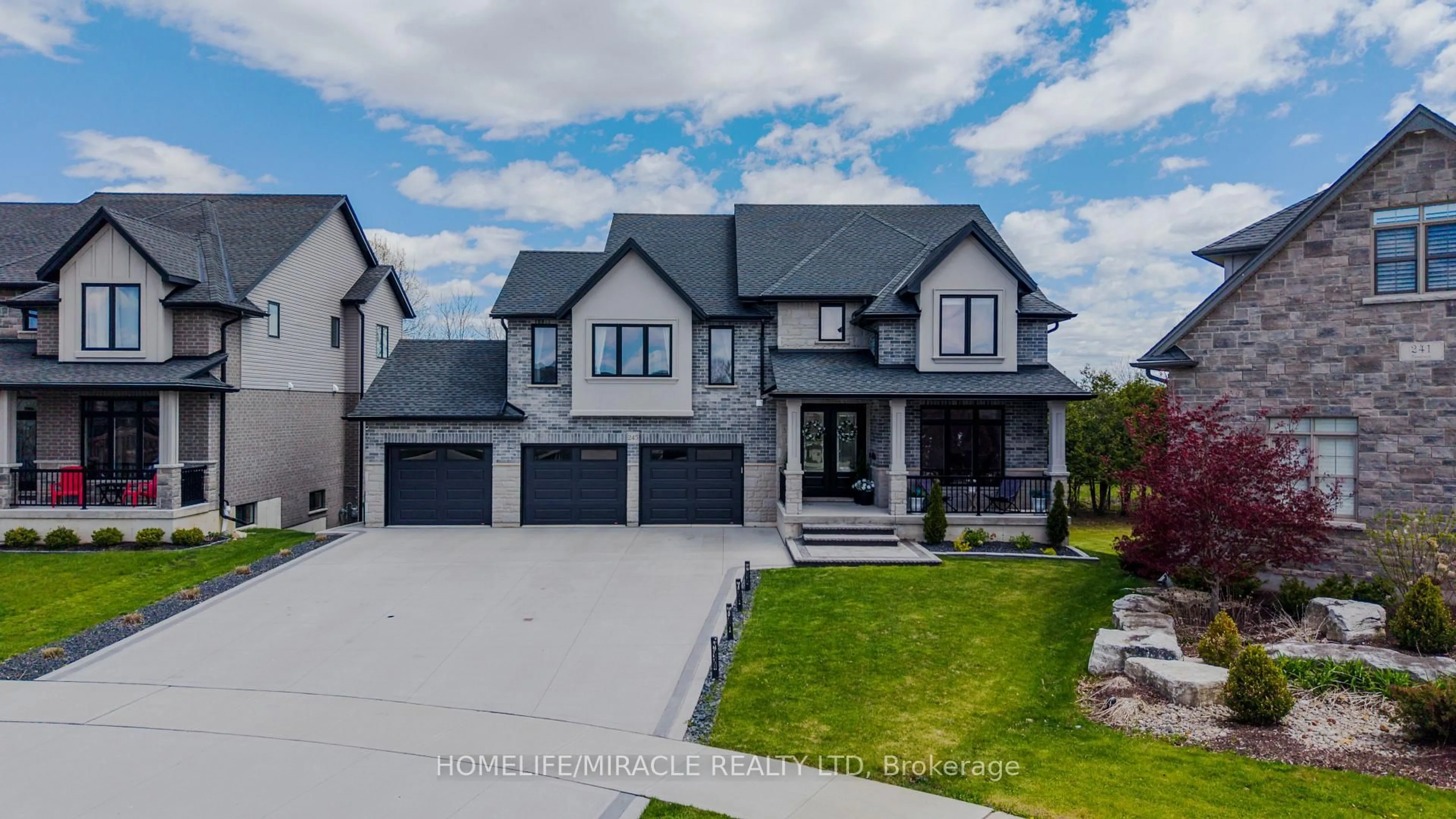 Home with brick exterior material, street for 245 Tamarack Blvd, Woodstock Ontario N4S 0E4