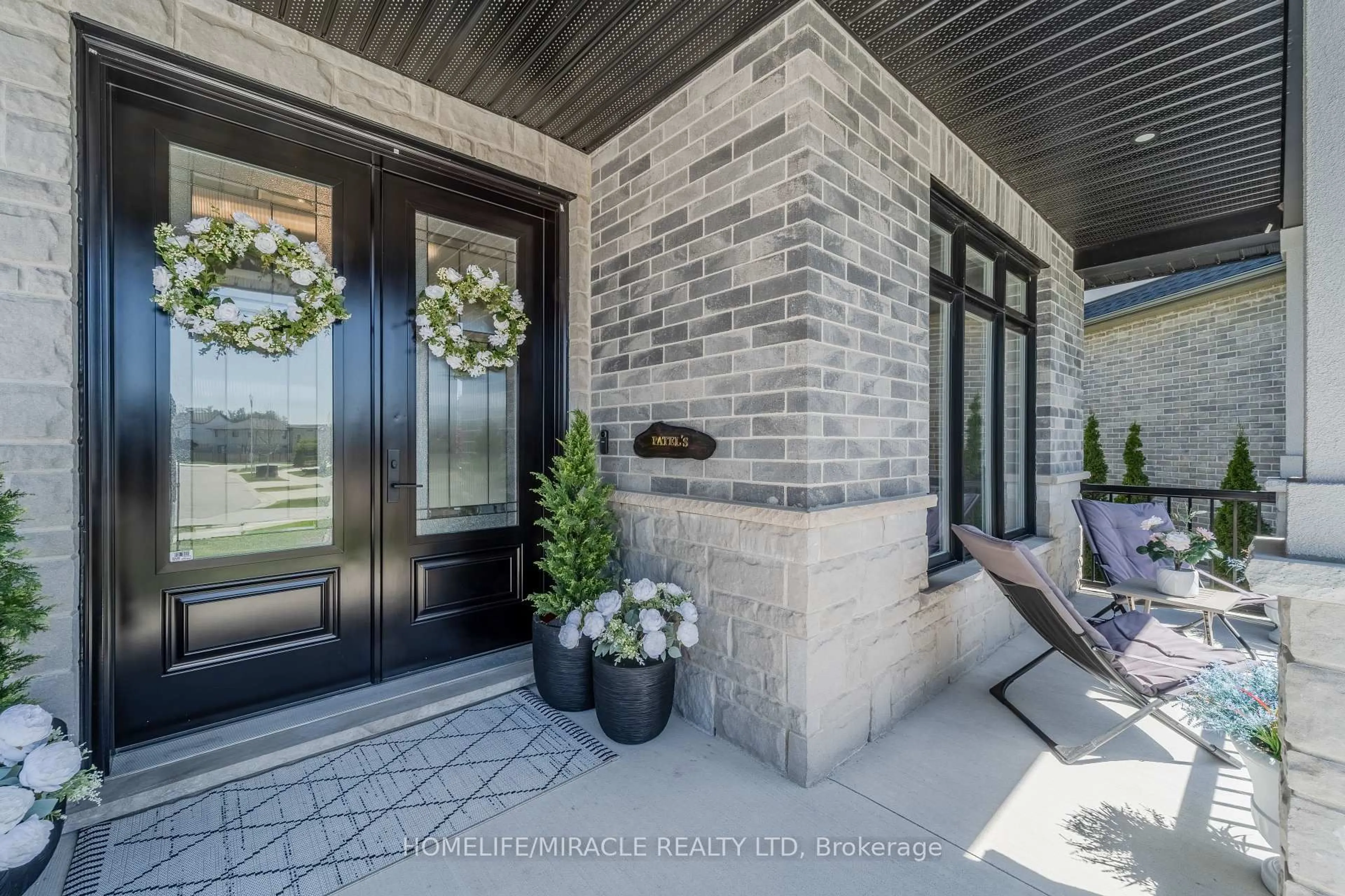 Home with brick exterior material, street for 245 Tamarack Blvd, Woodstock Ontario N4S 0E4