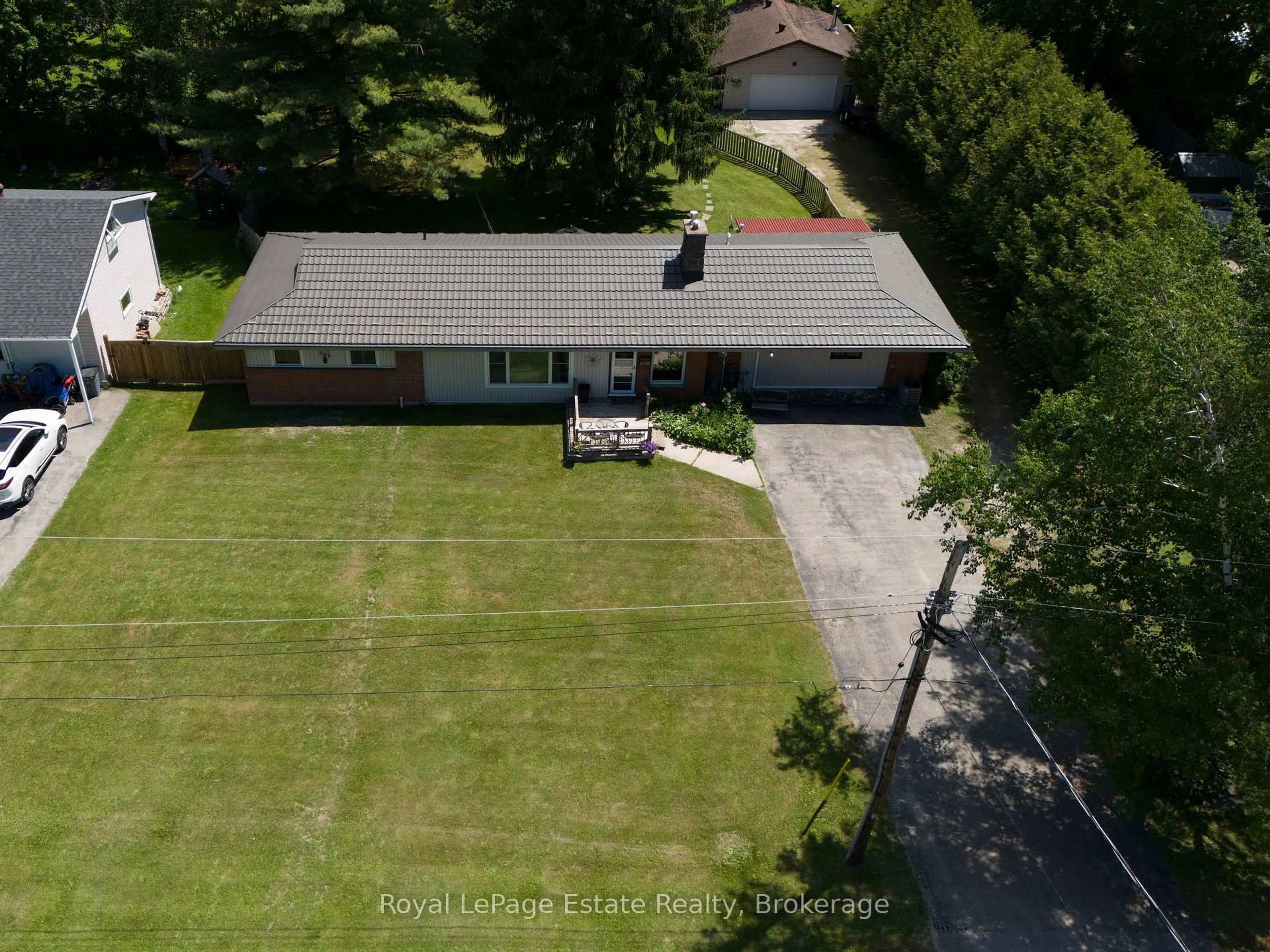 A pic from outside/outdoor area/front of a property/back of a property/a pic from drone, unknown for 497 Elizabeth St, South Bruce Peninsula Ontario N0H 1P0