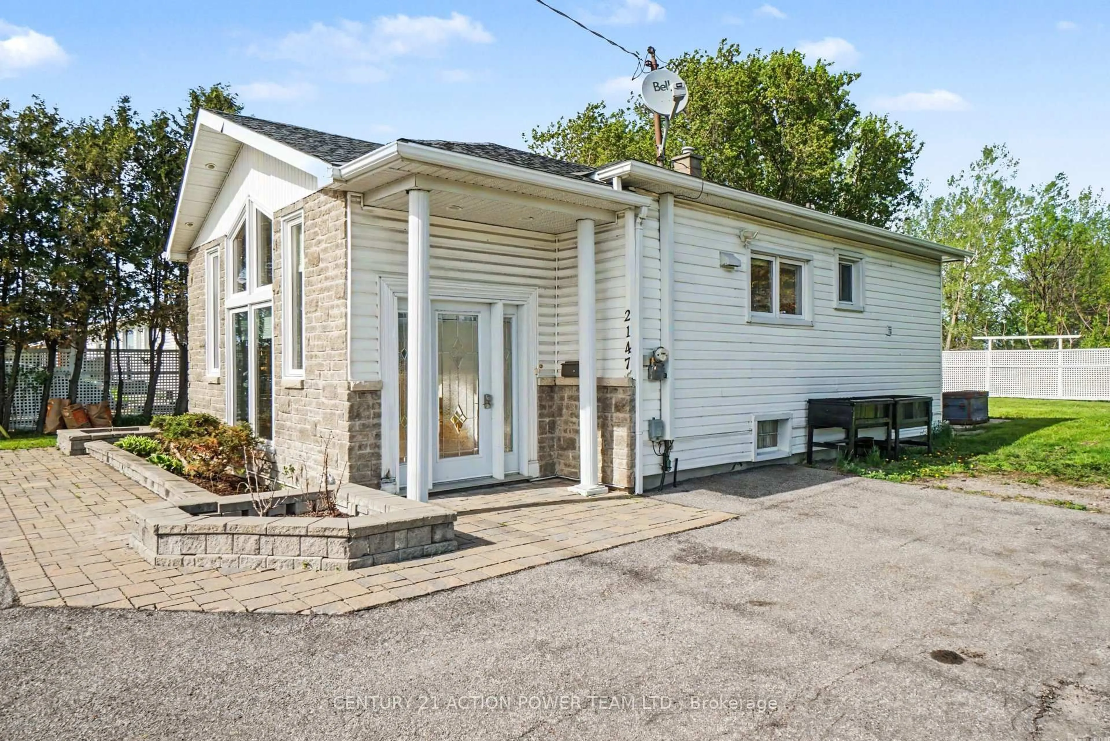 Home with vinyl exterior material, street for 2147 Mer Bleue Rd, Ottawa Ontario K4A 3T9