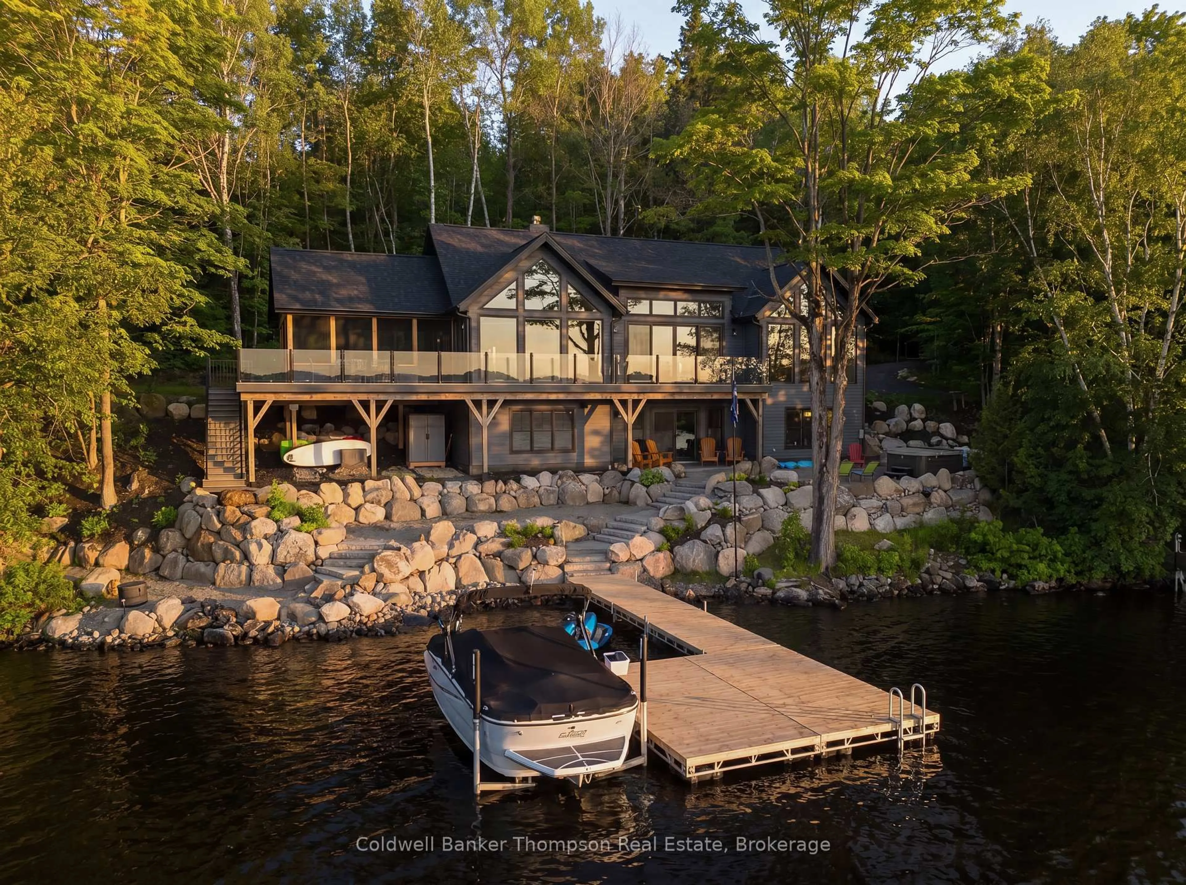 A pic from outside/outdoor area/front of a property/back of a property/a pic from drone, water/lake/river/ocean view for 161 Wilson Dr, Huntsville Ontario P1H 2J2
