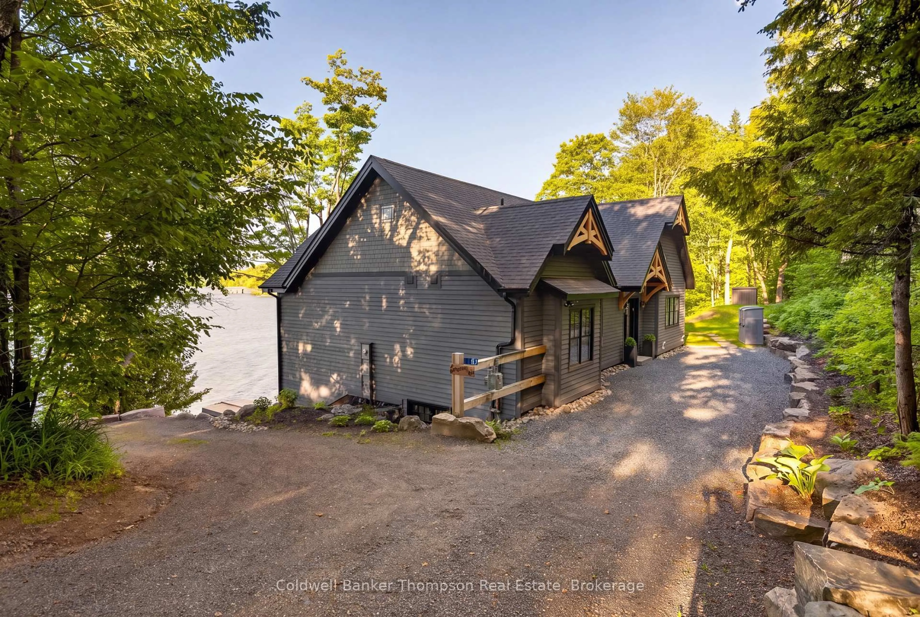A pic from outside/outdoor area/front of a property/back of a property/a pic from drone, water/lake/river/ocean view for 161 Wilson Dr, Huntsville Ontario P1H 2J2
