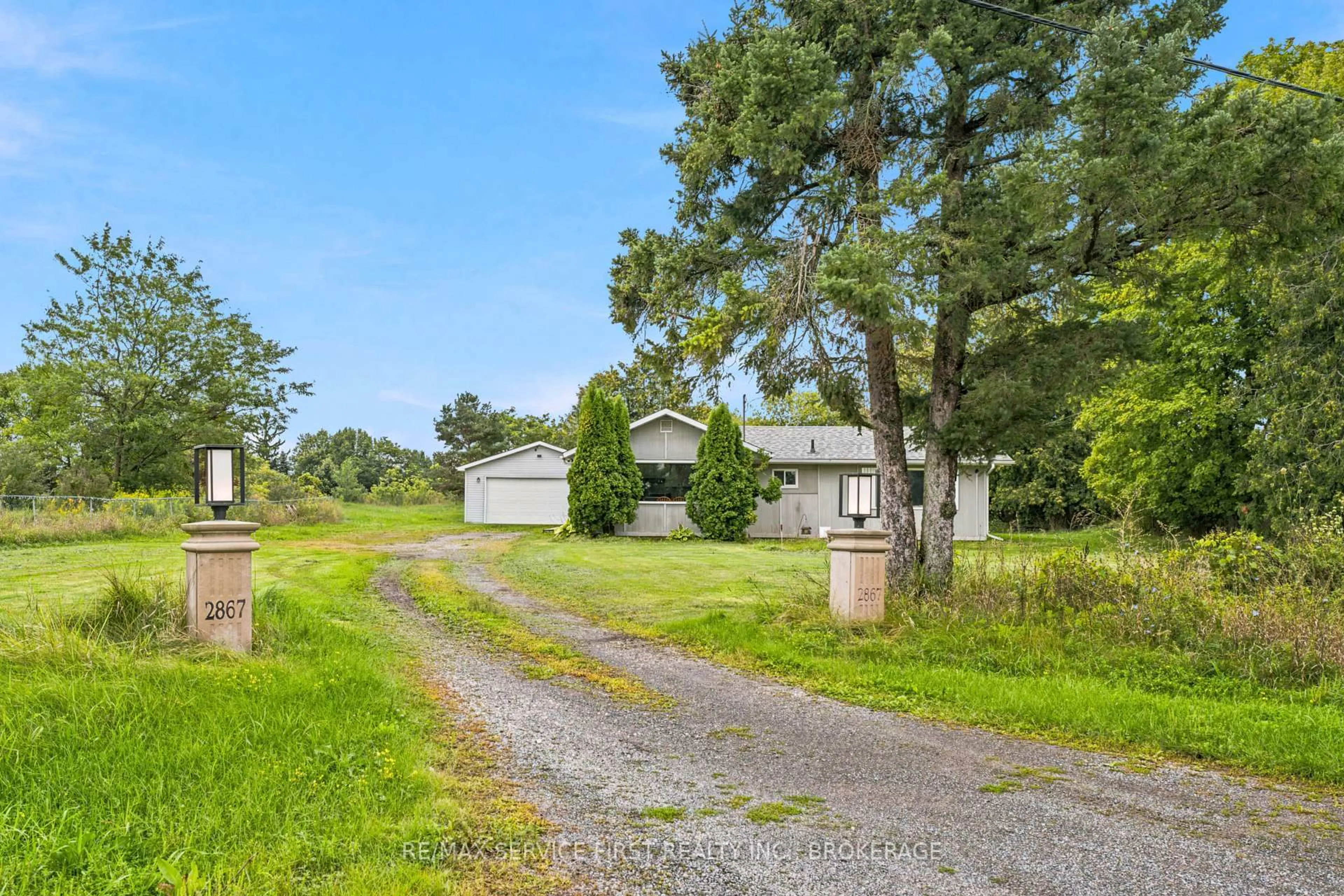 A pic from outside/outdoor area/front of a property/back of a property/a pic from drone, street for 2867 Highway 2, Kingston Ontario K7L 5H6