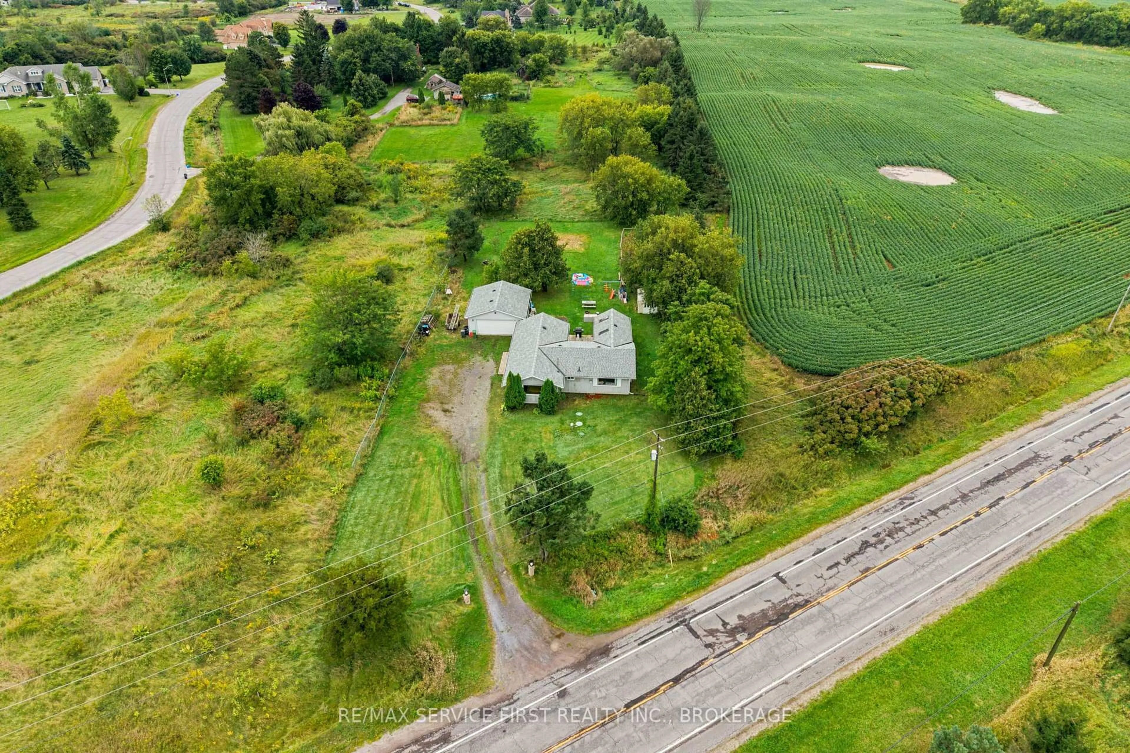 A pic from outside/outdoor area/front of a property/back of a property/a pic from drone, street for 2867 Highway 2, Kingston Ontario K7L 5H6