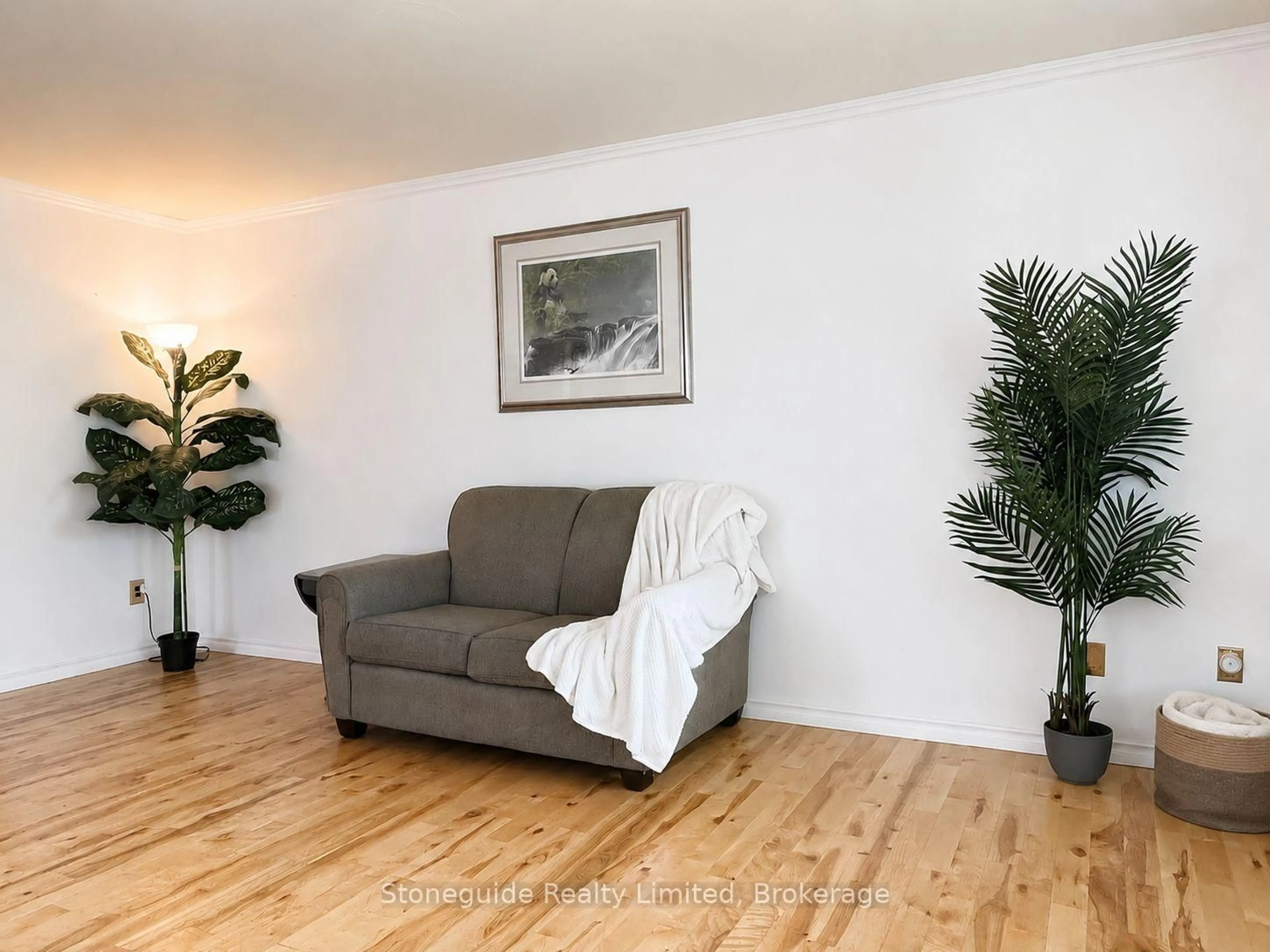 Living room with furniture, wood/laminate floor for 1139 Danita Blvd, Peterborough Ontario K9J 7J9
