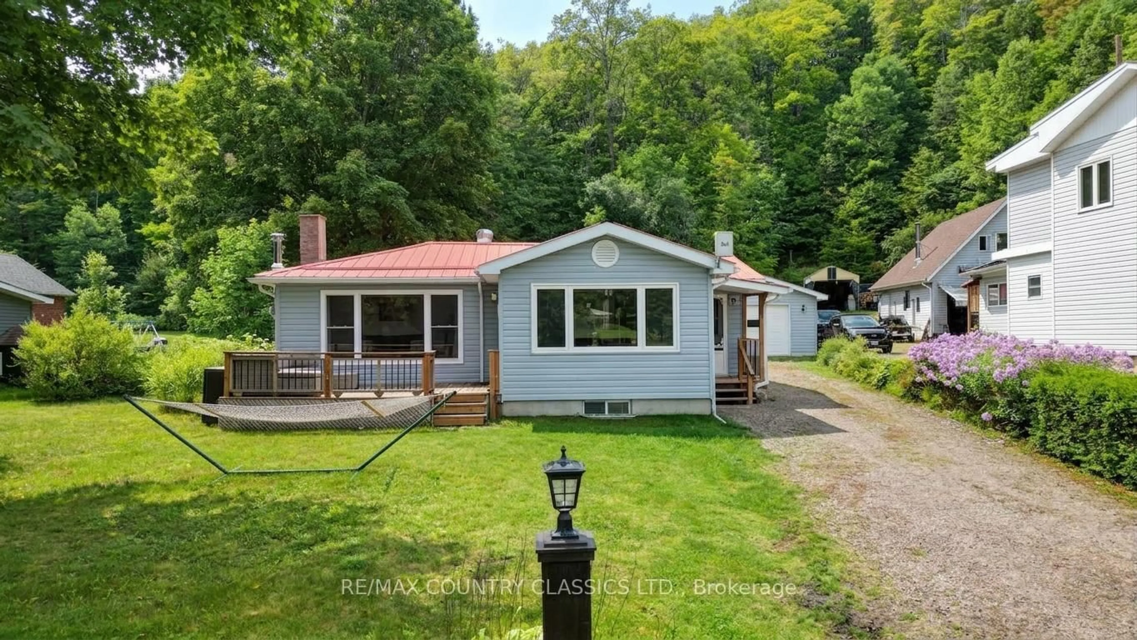 A pic from outside/outdoor area/front of a property/back of a property/a pic from drone, unknown for 1055 Burleigh Rd, Highlands East Ontario K0L 3C0