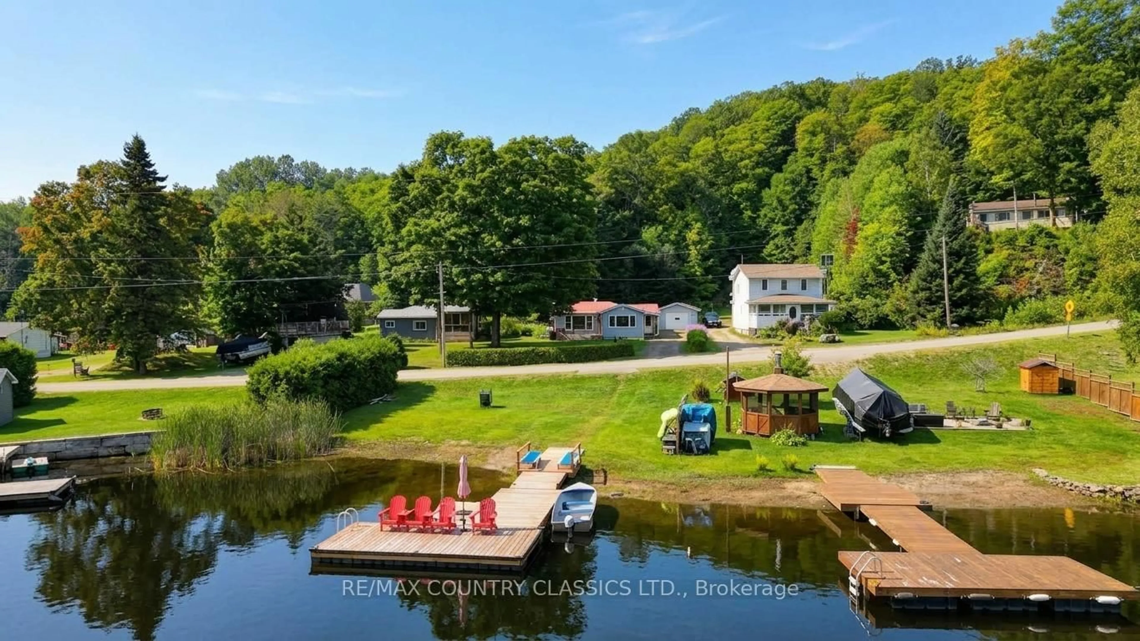 A pic from outside/outdoor area/front of a property/back of a property/a pic from drone, water/lake/river/ocean view for 1055 Burleigh Rd, Highlands East Ontario K0L 3C0