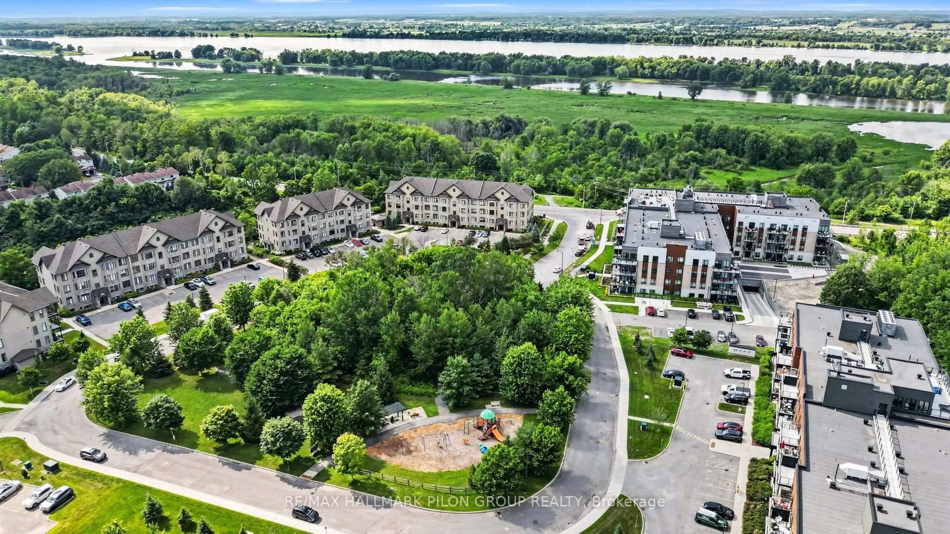 A pic from outside/outdoor area/front of a property/back of a property/a pic from drone, water/lake/river/ocean view for 10 Prestige Circ #7, Ottawa Ontario K4A 0W9