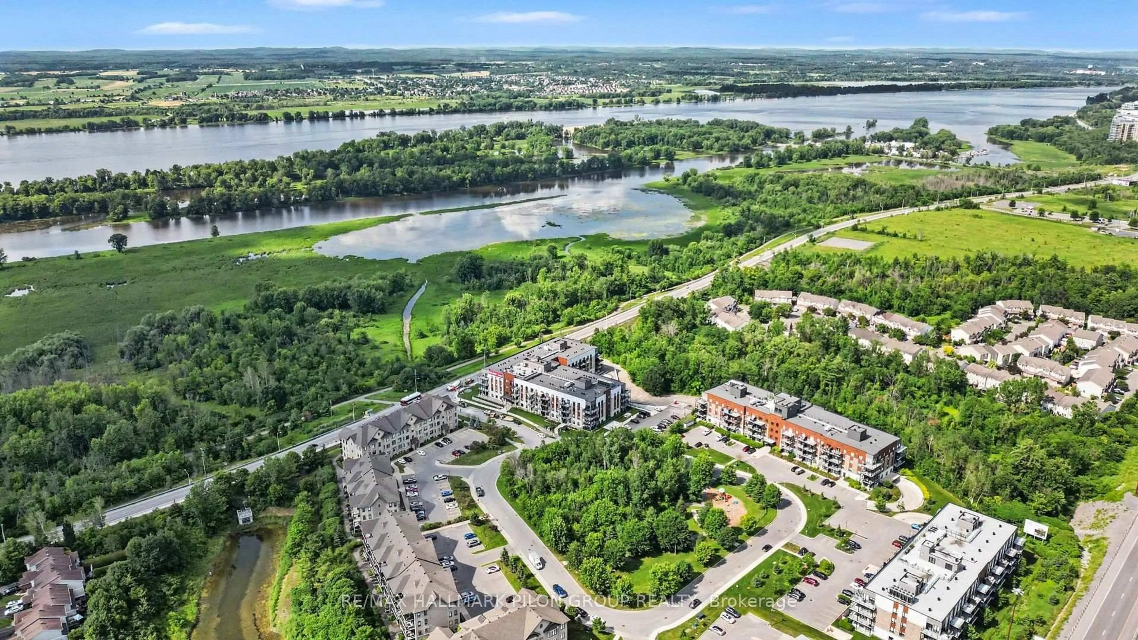 A pic from outside/outdoor area/front of a property/back of a property/a pic from drone, water/lake/river/ocean view for 10 Prestige Circ #7, Ottawa Ontario K4A 0W9