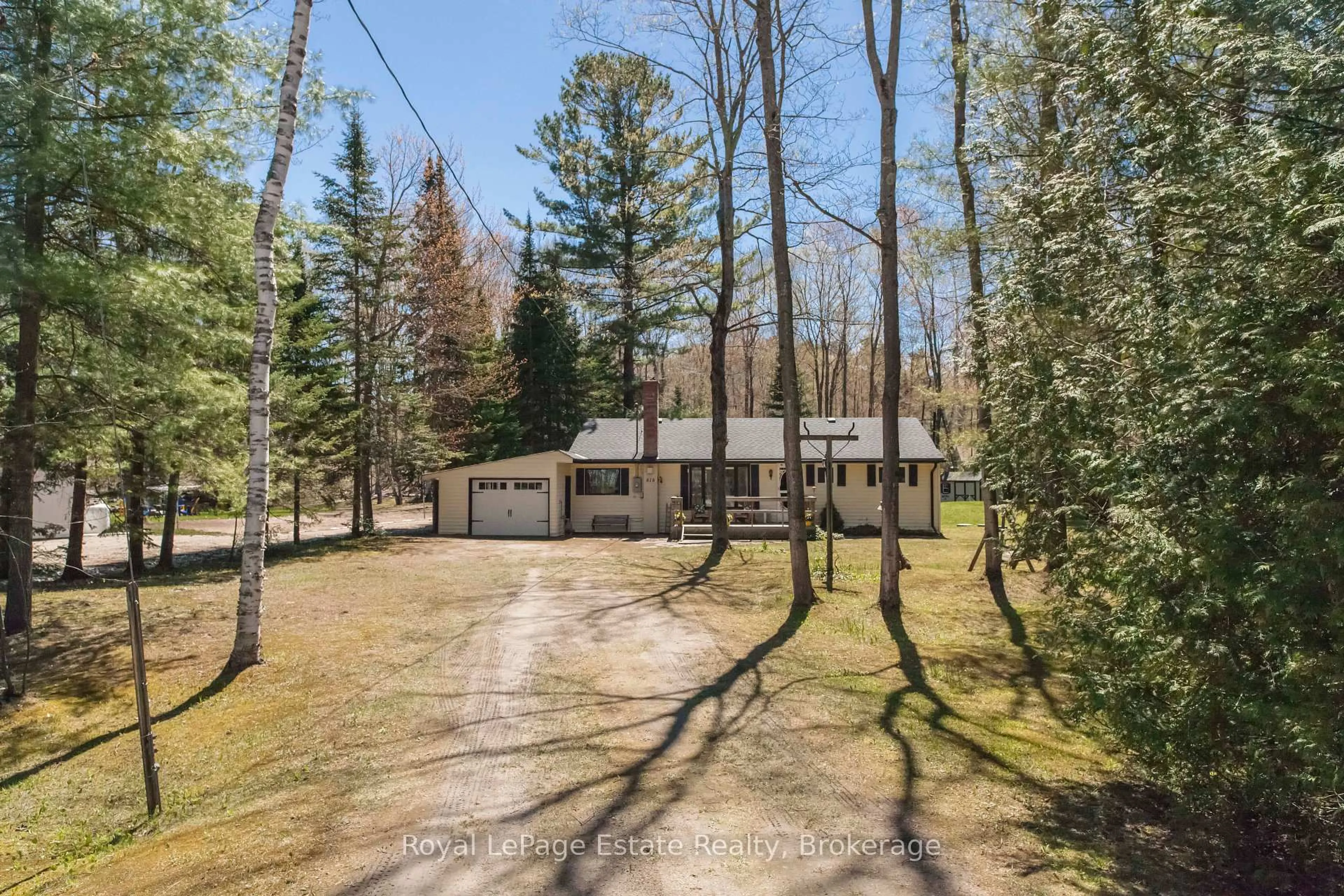 A pic from outside/outdoor area/front of a property/back of a property/a pic from drone, forest/trees view for 818 Sixth St, South Bruce Peninsula Ontario N0H 2G0