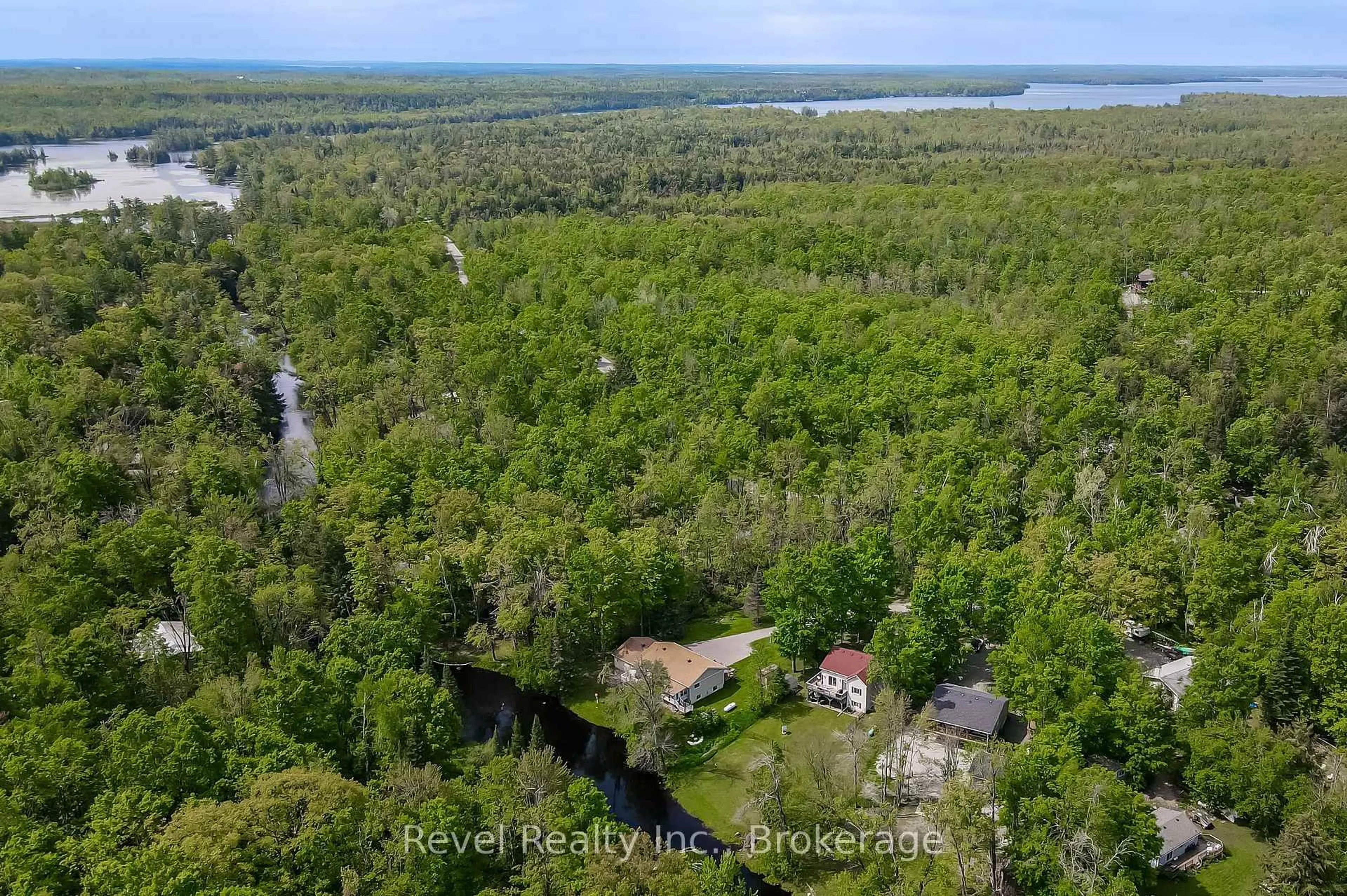 A pic from outside/outdoor area/front of a property/back of a property/a pic from drone, water/lake/river/ocean view for 15 Fire Route 92, Trent Lakes Ontario K0M 1A0