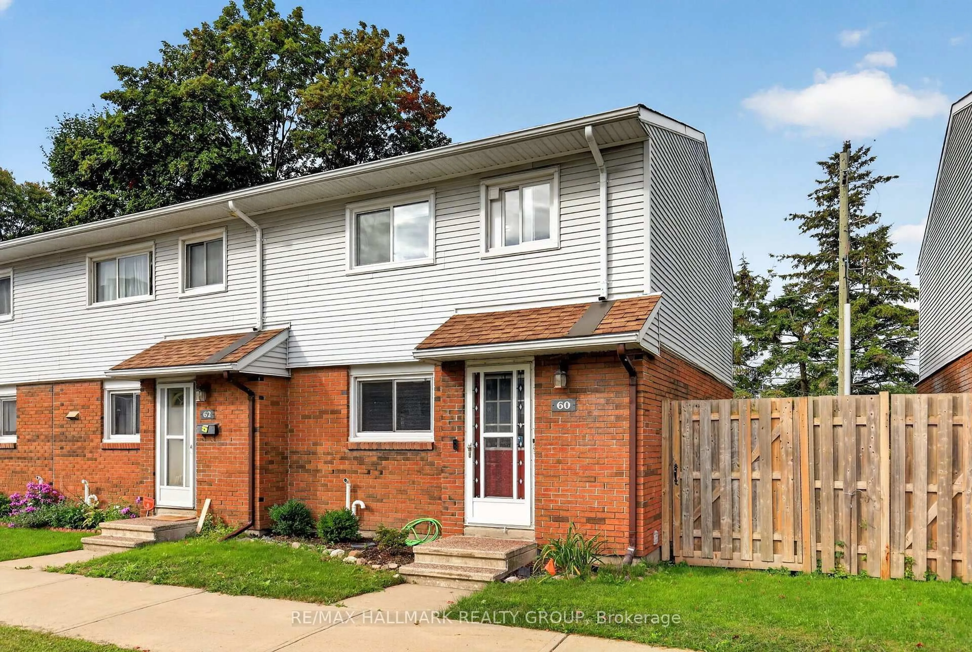Home with brick exterior material, street for 1045 Morrison Dr #60, Ottawa Ontario K2H 7L2