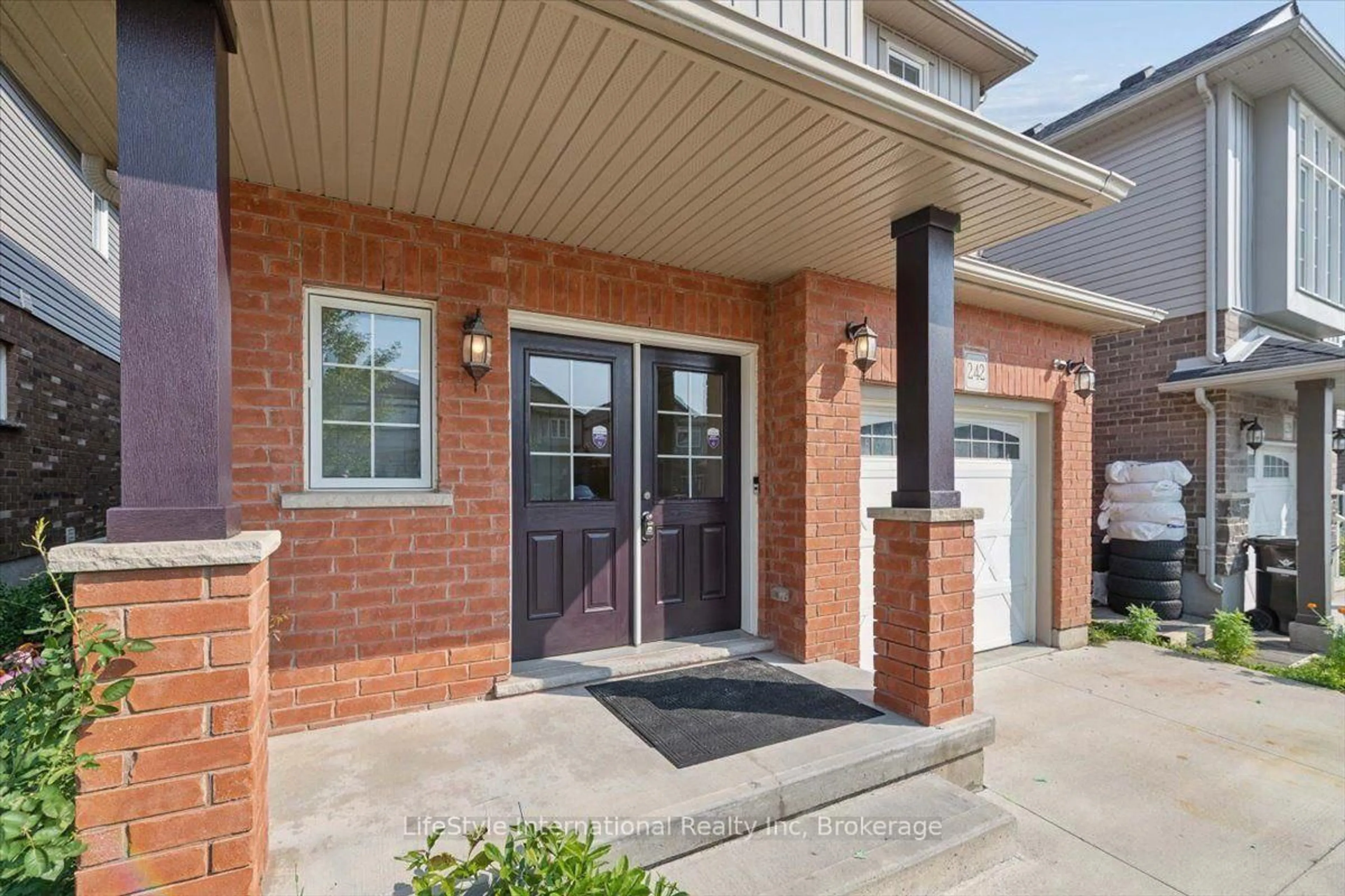Home with brick exterior material, street for 242 Moorlands Cres, Kitchener Ontario N2P 0C4