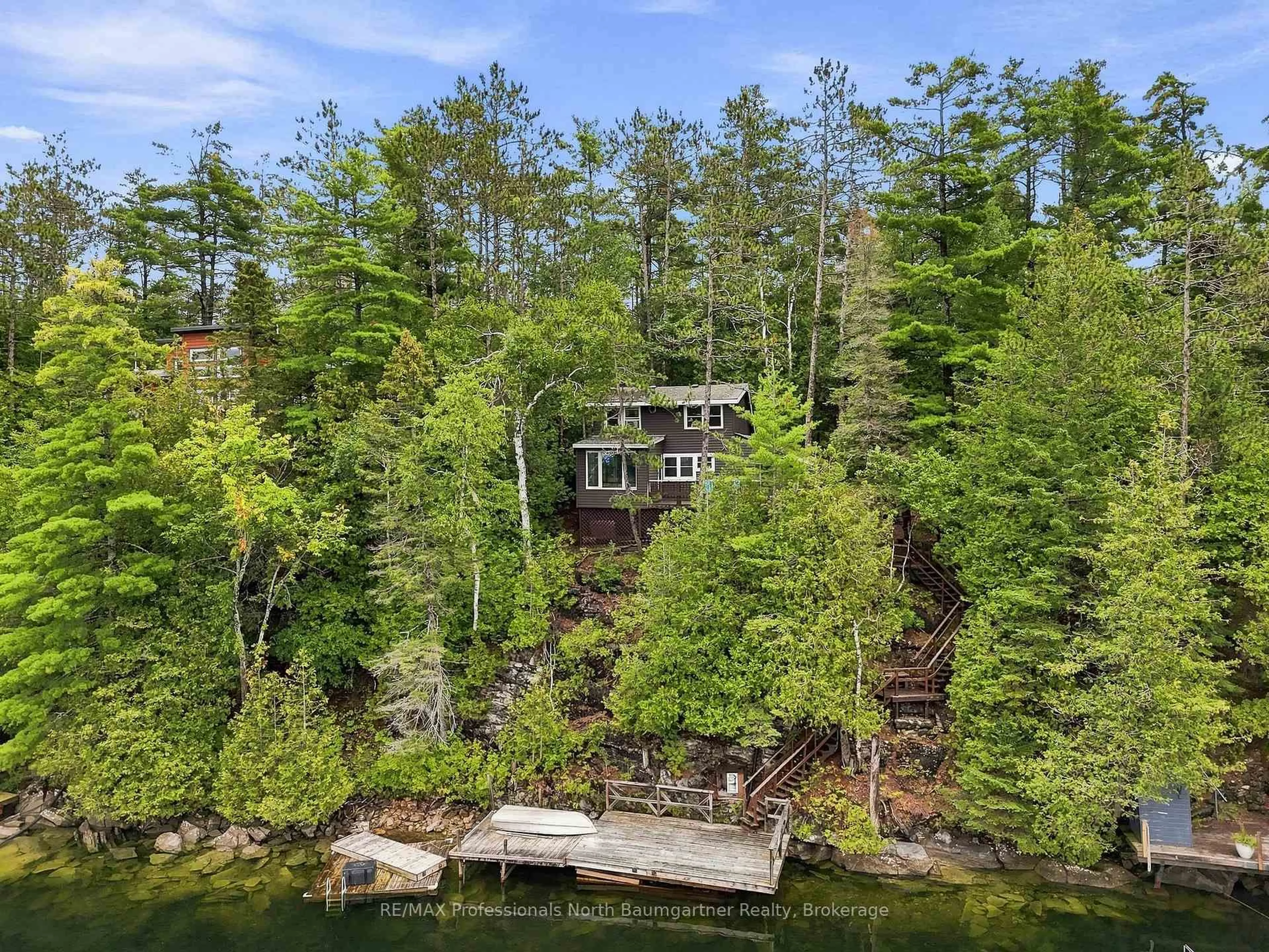 A pic from outside/outdoor area/front of a property/back of a property/a pic from drone, water/lake/river/ocean view for 1803 Crystal Lake Rd, Trent Lakes Ontario K0M 2A0