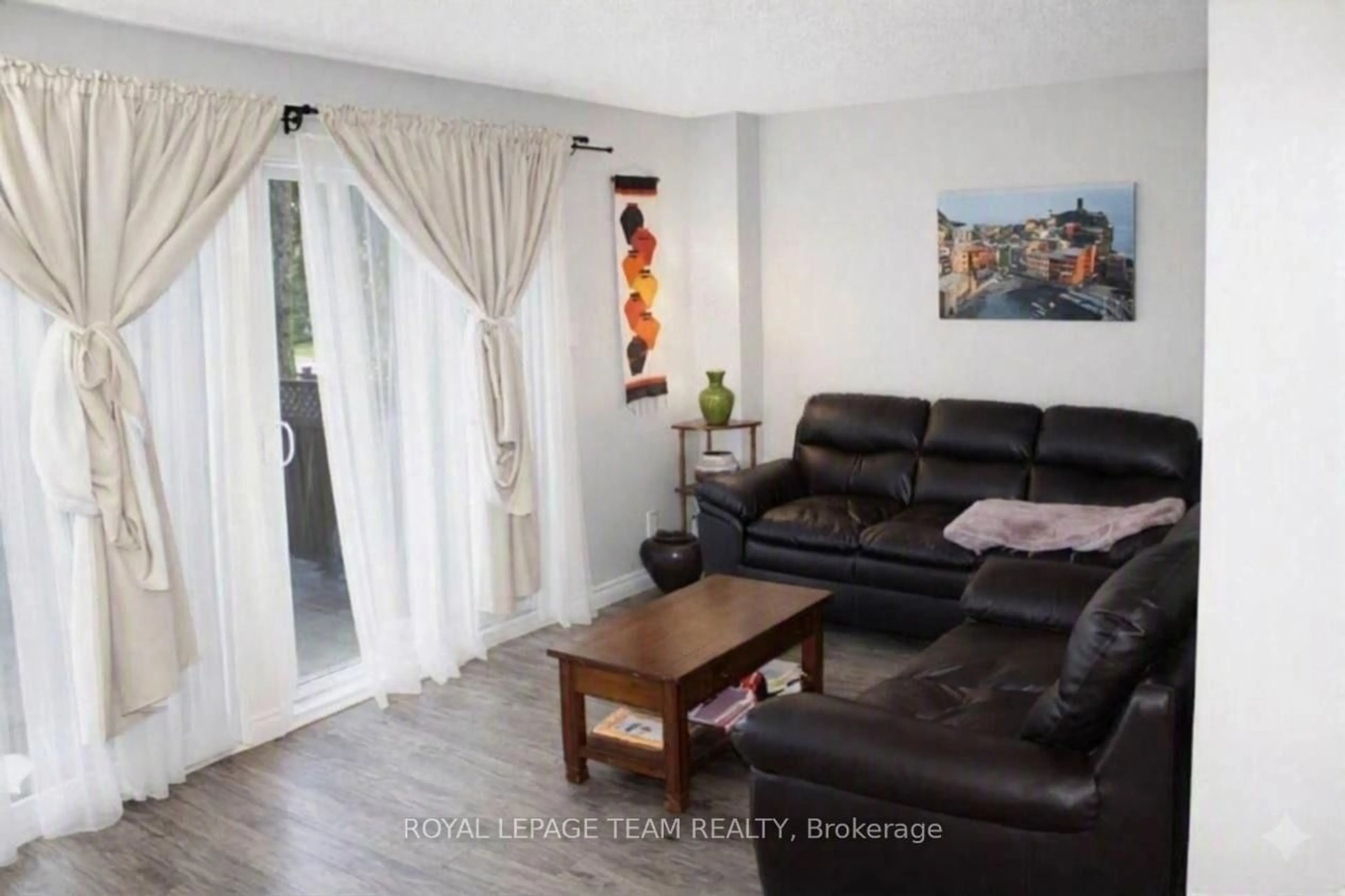 Living room with furniture, wood/laminate floor for 503 Sidney Dr #53, Ottawa Ontario K4A 2W6