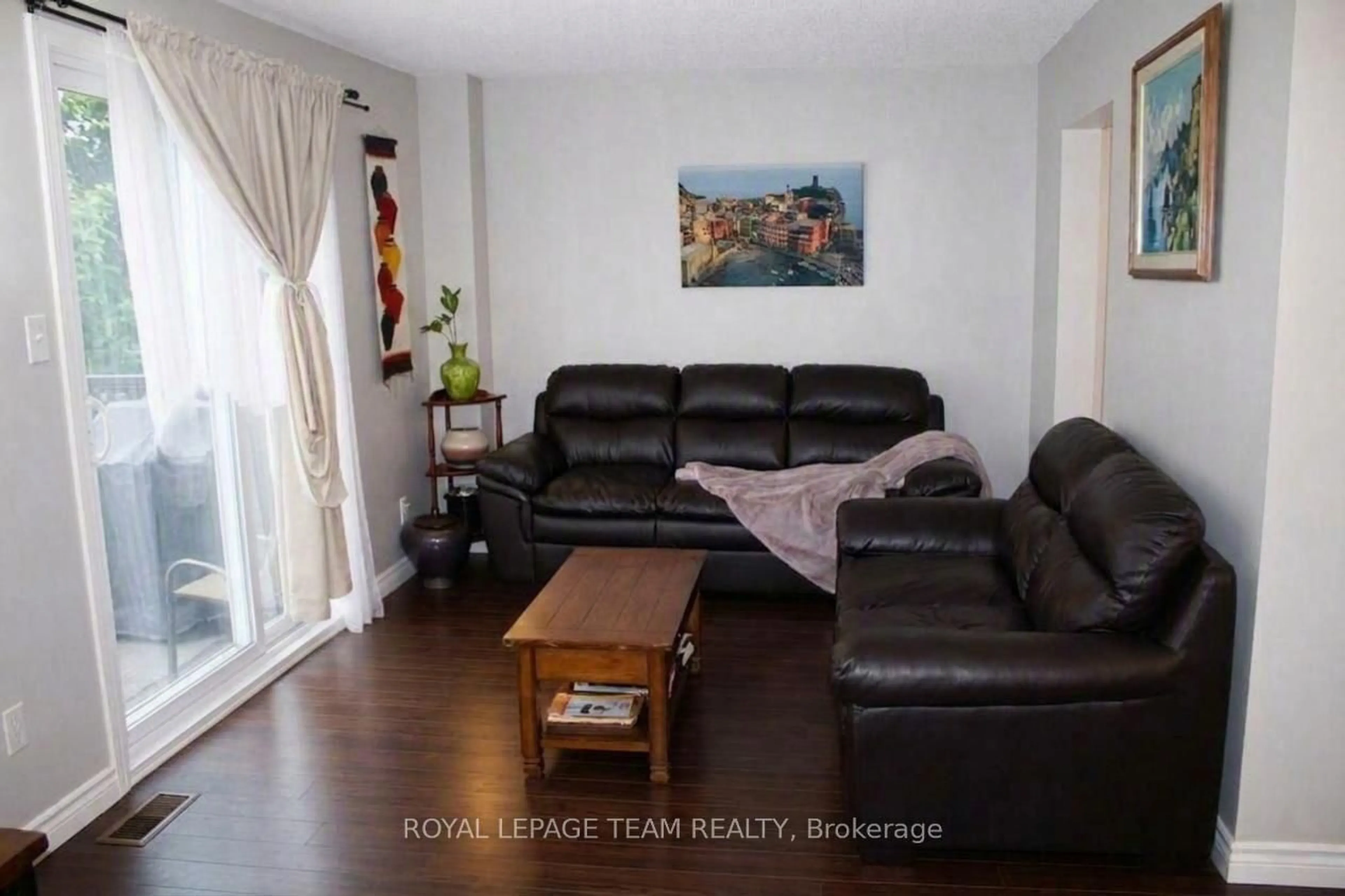 Living room with furniture, wood/laminate floor for 503 Sidney Dr #53, Ottawa Ontario K4A 2W6