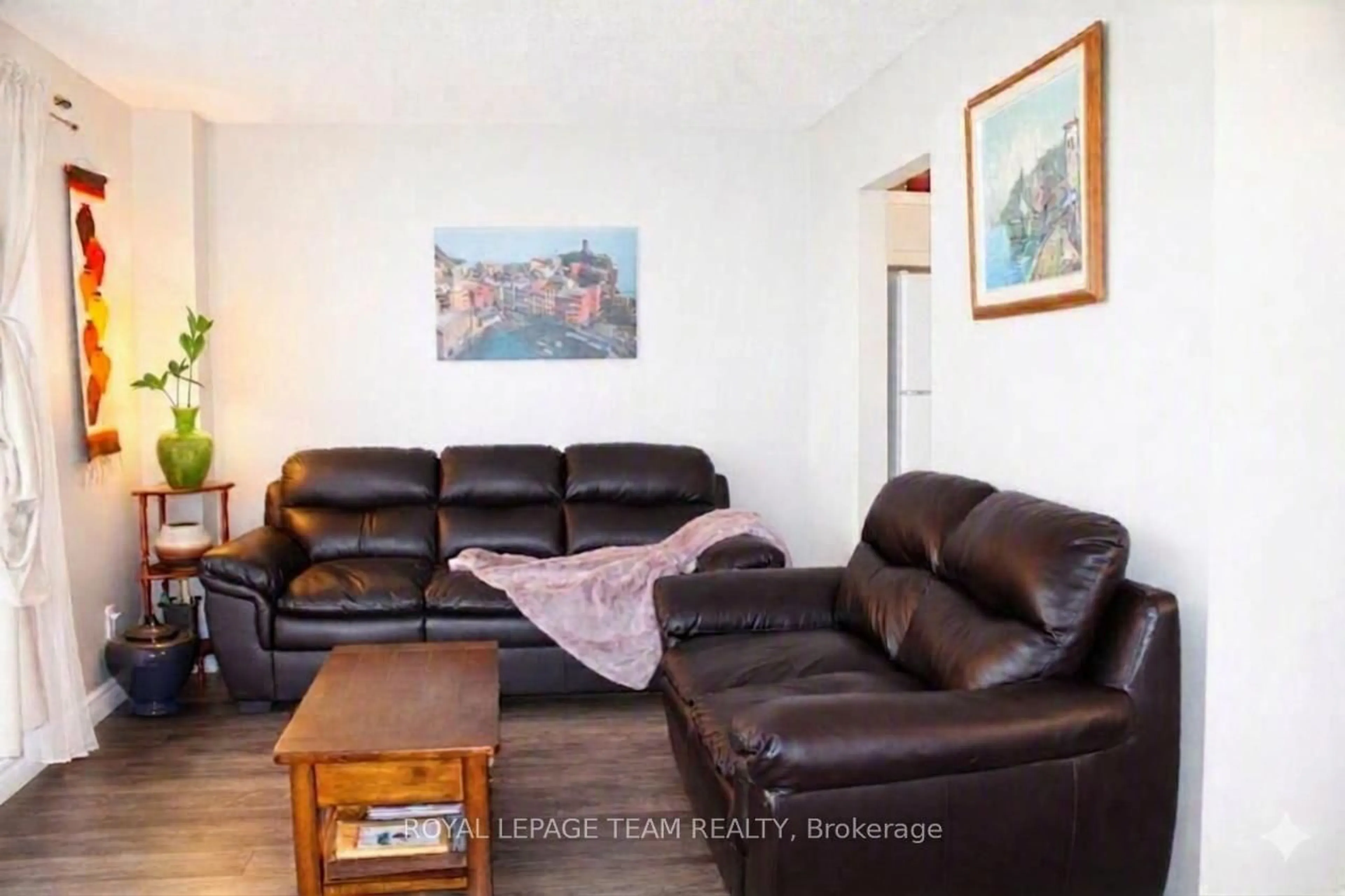 Living room with furniture, wood/laminate floor for 503 Sidney Dr #53, Ottawa Ontario K4A 2W6