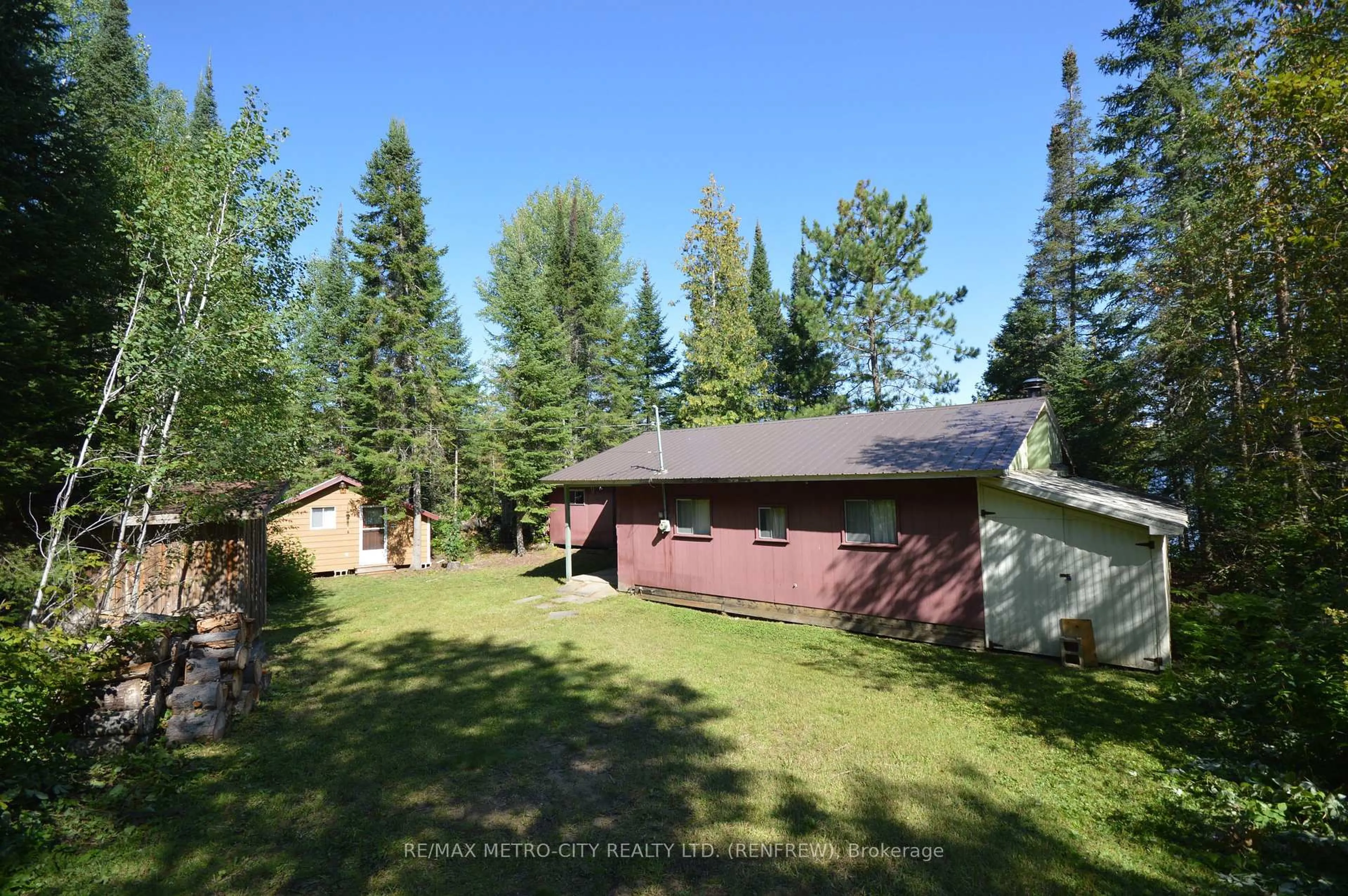 A pic from outside/outdoor area/front of a property/back of a property/a pic from drone, forest/trees view for 482 Cameron Lake Rd, Palmer Rapids Ontario K0J 2E0