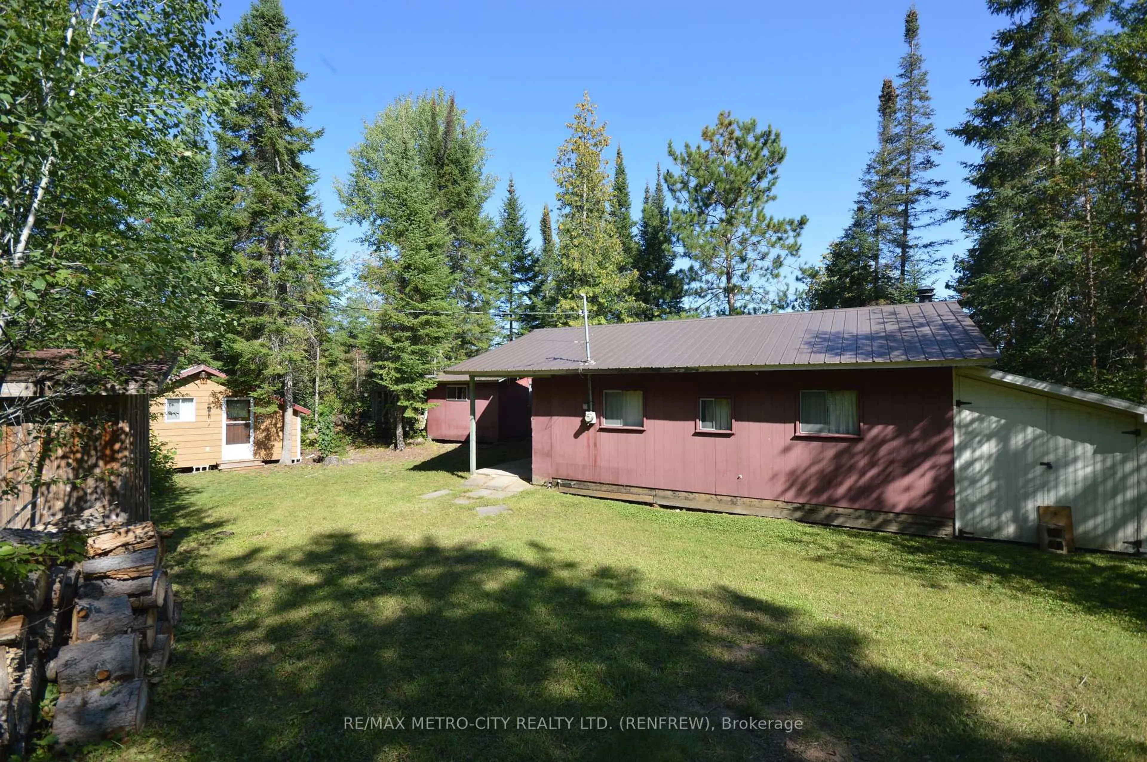 A pic from outside/outdoor area/front of a property/back of a property/a pic from drone, forest/trees view for 482 Cameron Lake Rd, Palmer Rapids Ontario K0J 2E0