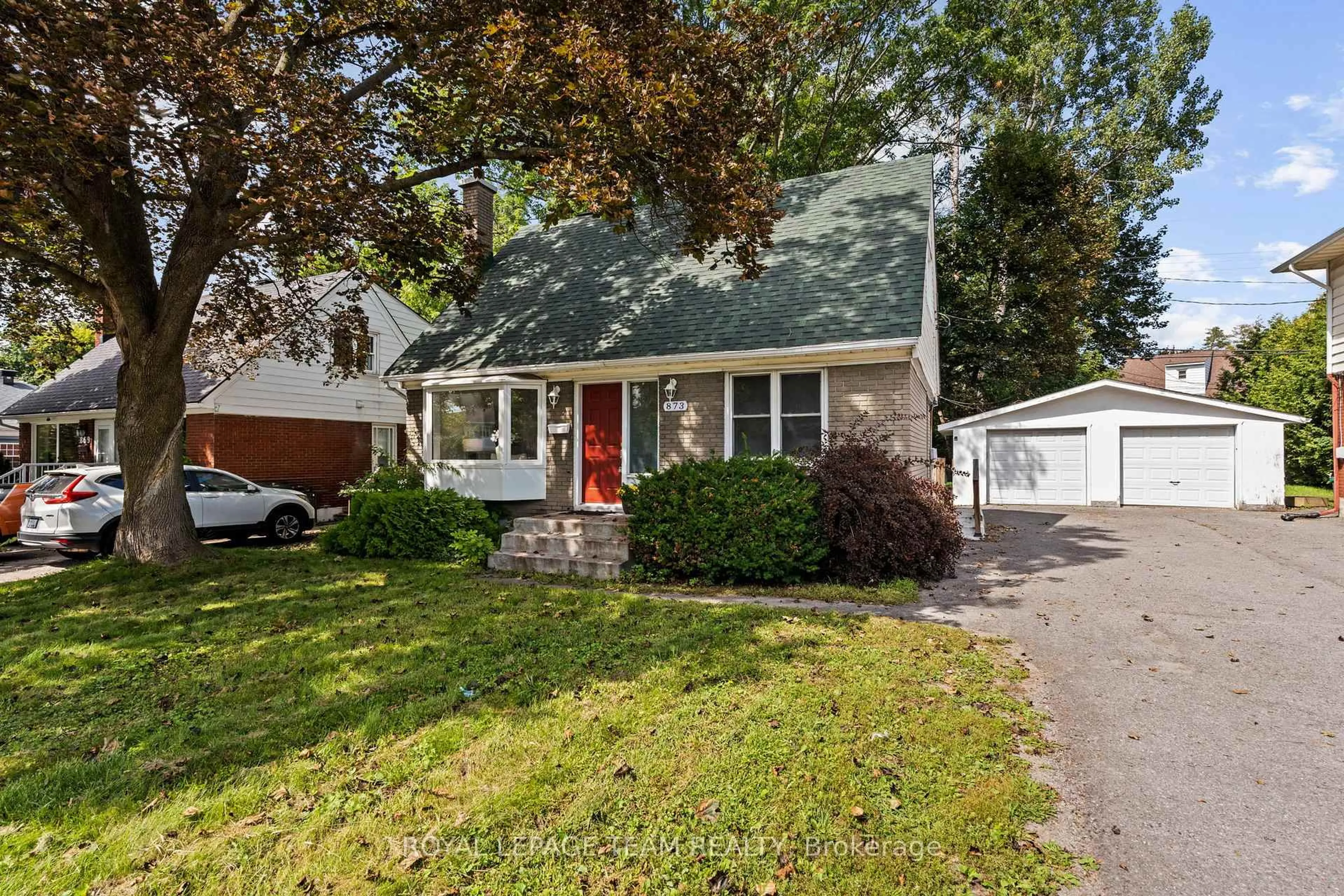 Home with vinyl exterior material, street for 873 Smyth Rd, Ottawa Ontario K1G 1P4
