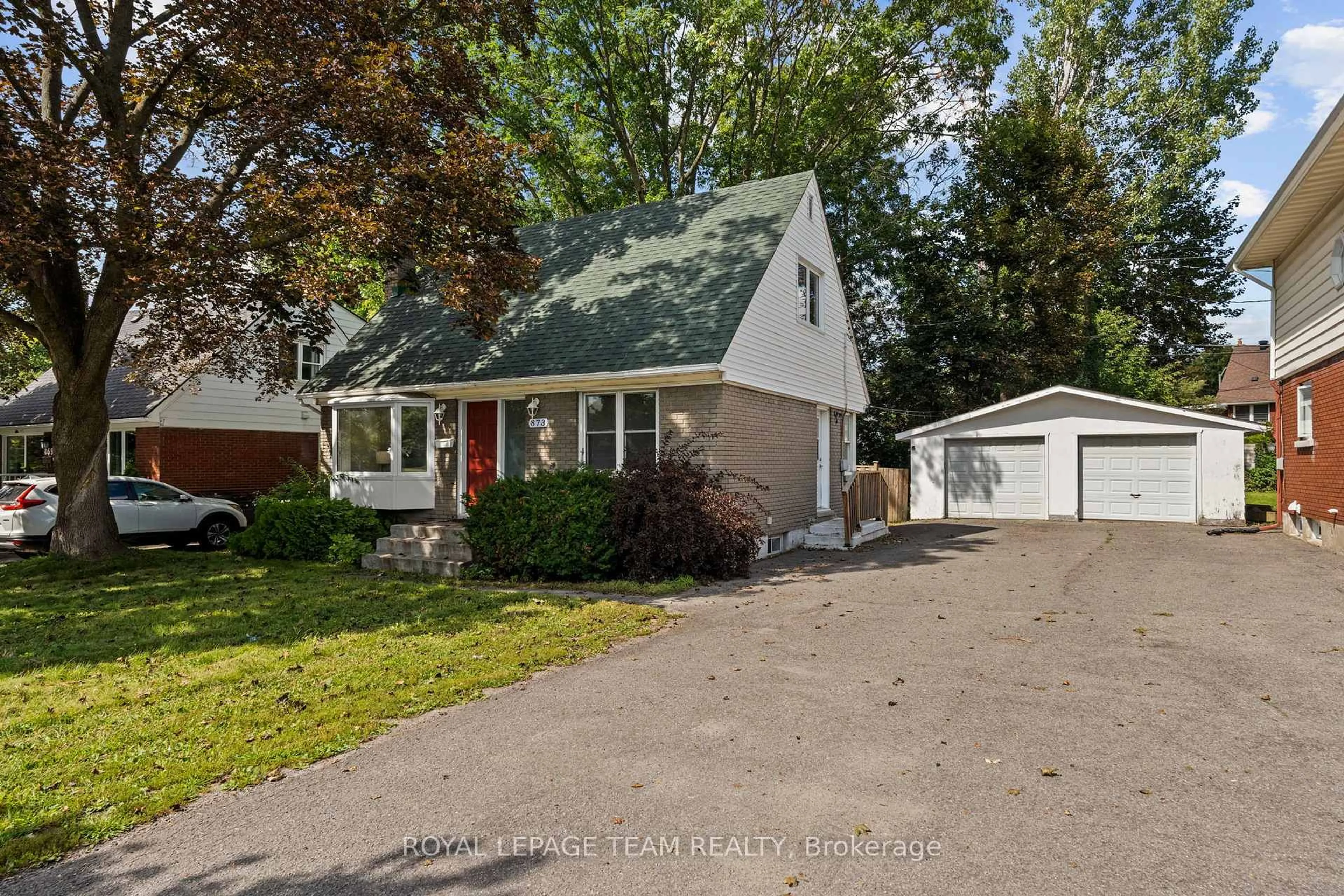 Home with vinyl exterior material, street for 873 Smyth Rd, Ottawa Ontario K1G 1P4