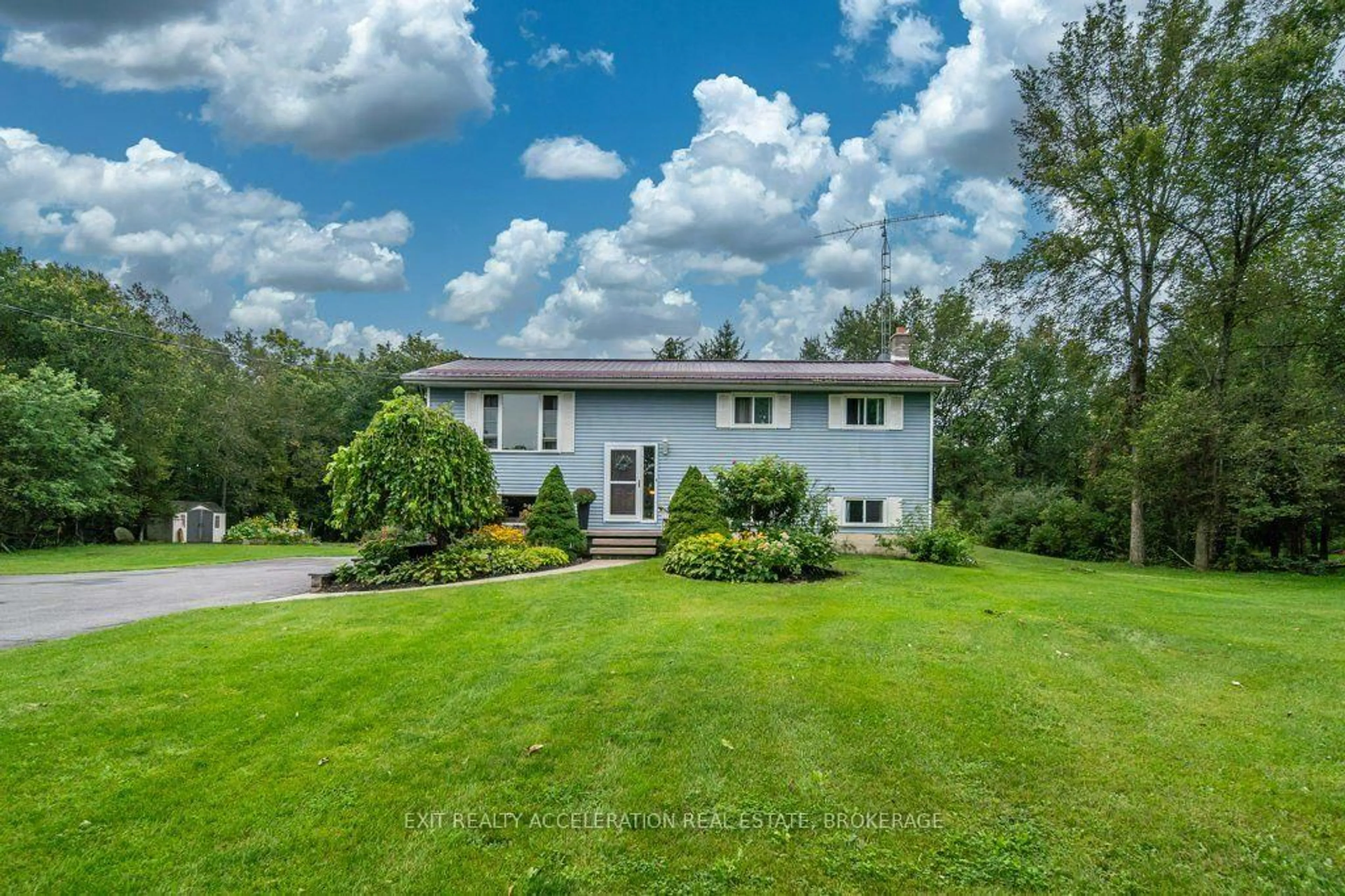 A pic from outside/outdoor area/front of a property/back of a property/a pic from drone, water/lake/river/ocean view for 4524 County Rd 1, Yarker Ontario K0K 3N0