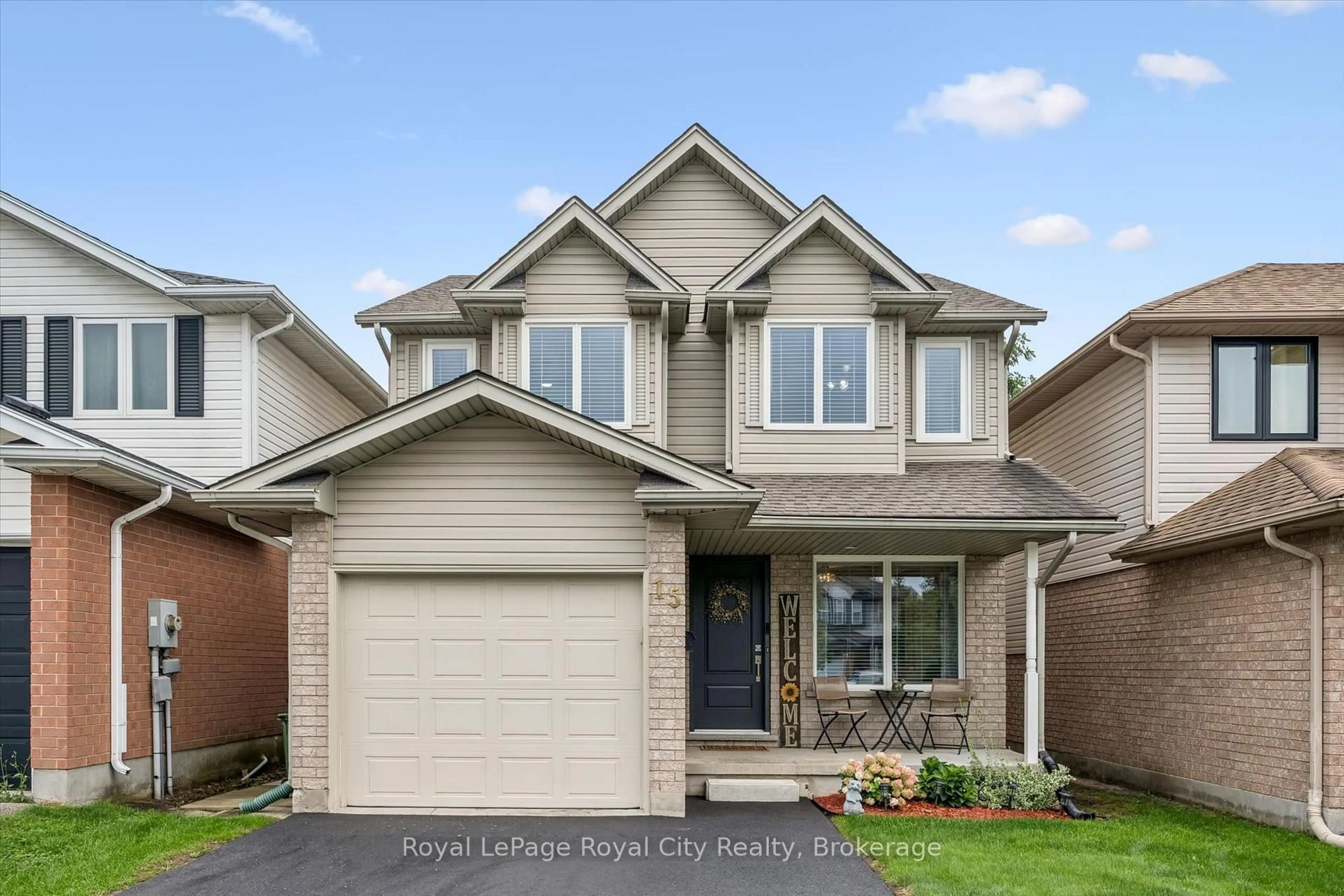 Home with brick exterior material, street for 15 Trailbrook Lane, Guelph Ontario N1E 7B6