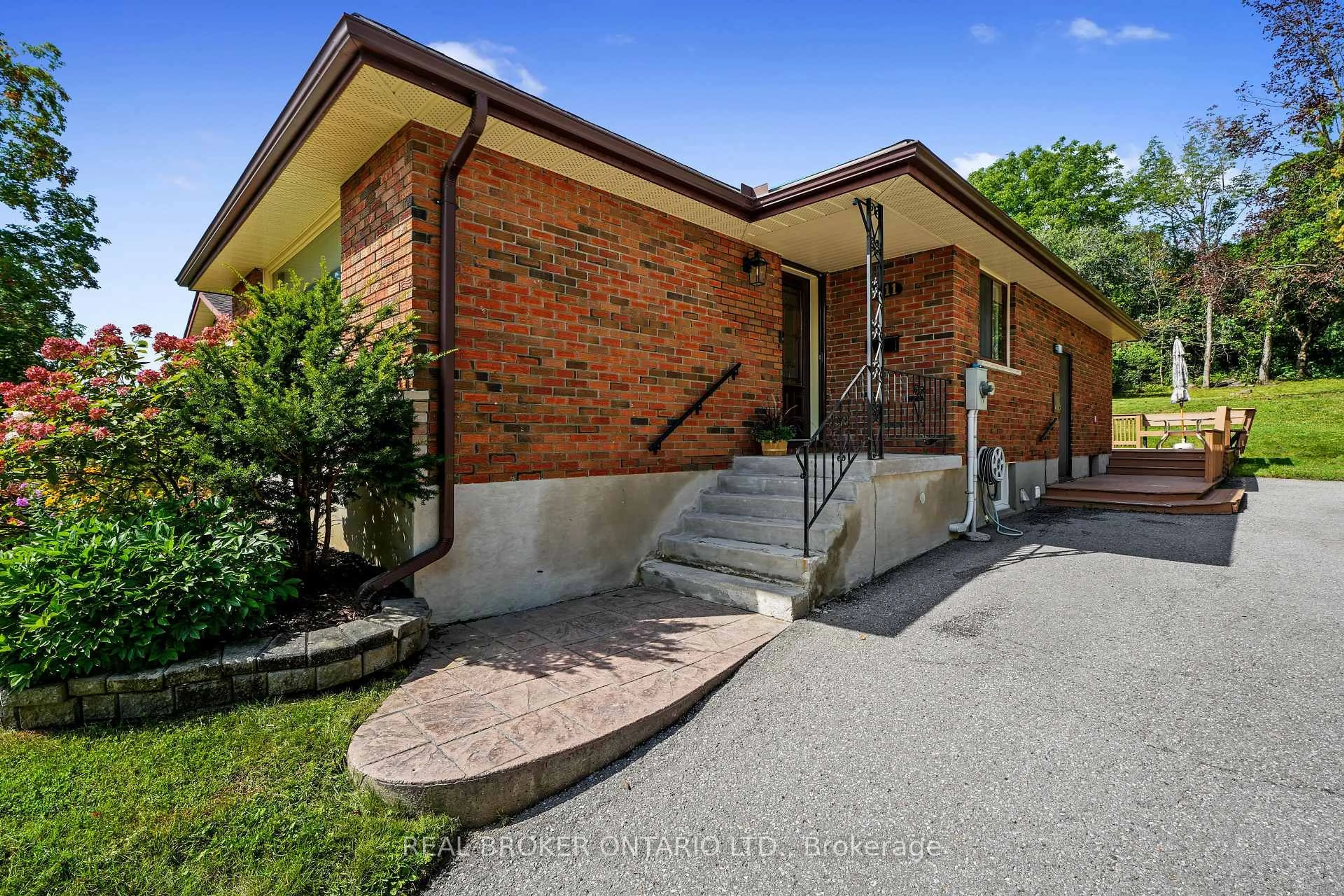 Home with brick exterior material, street for 1311 Edmison Dr, Peterborough Ontario K9H 6V2