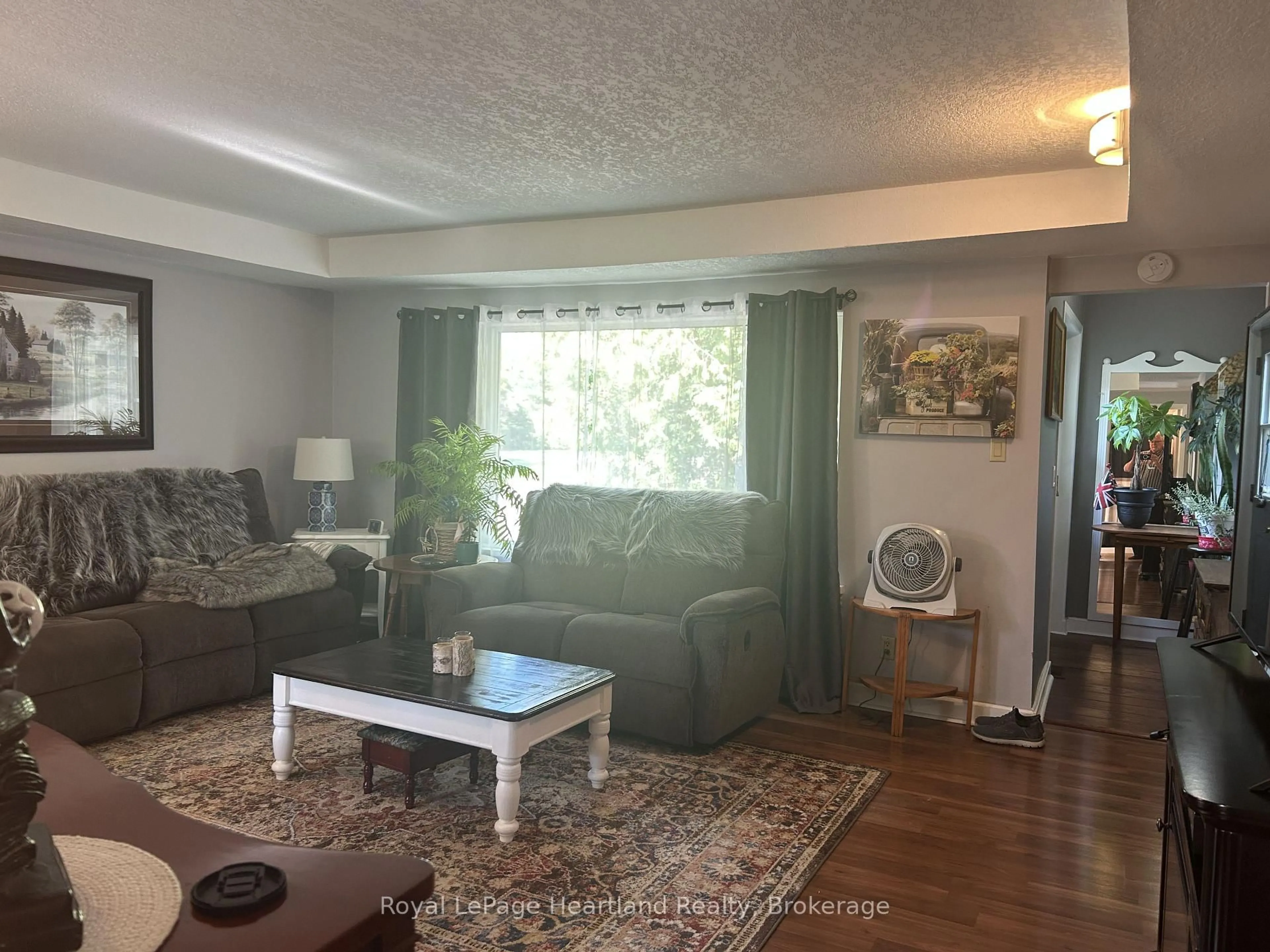 Living room with furniture, wood/laminate floor for 90 Mary St, North Huron Ontario N0G 2W0
