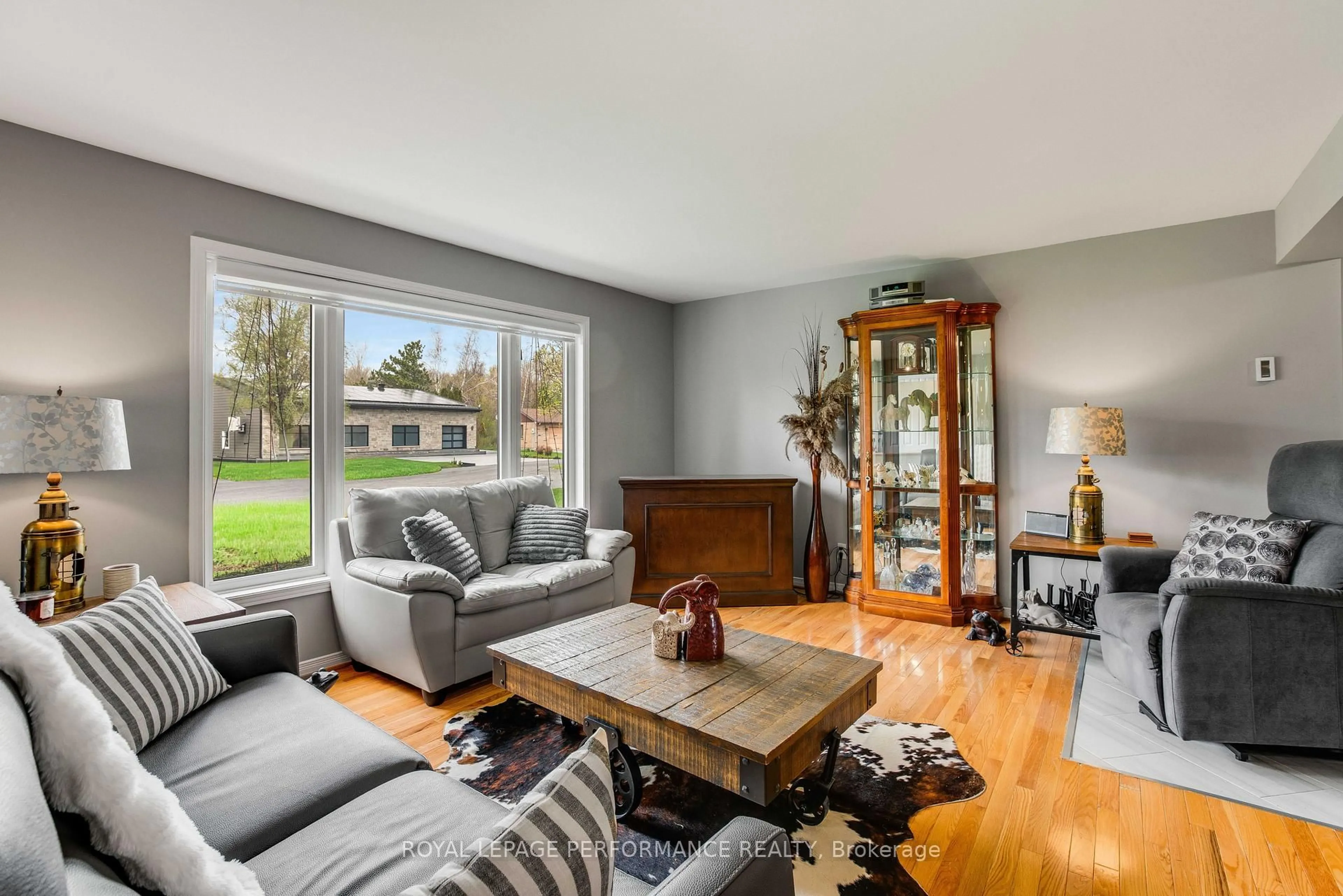Living room with furniture, wood/laminate floor for 6277 Macrae Crt, South Glengarry Ontario K0C 1E0