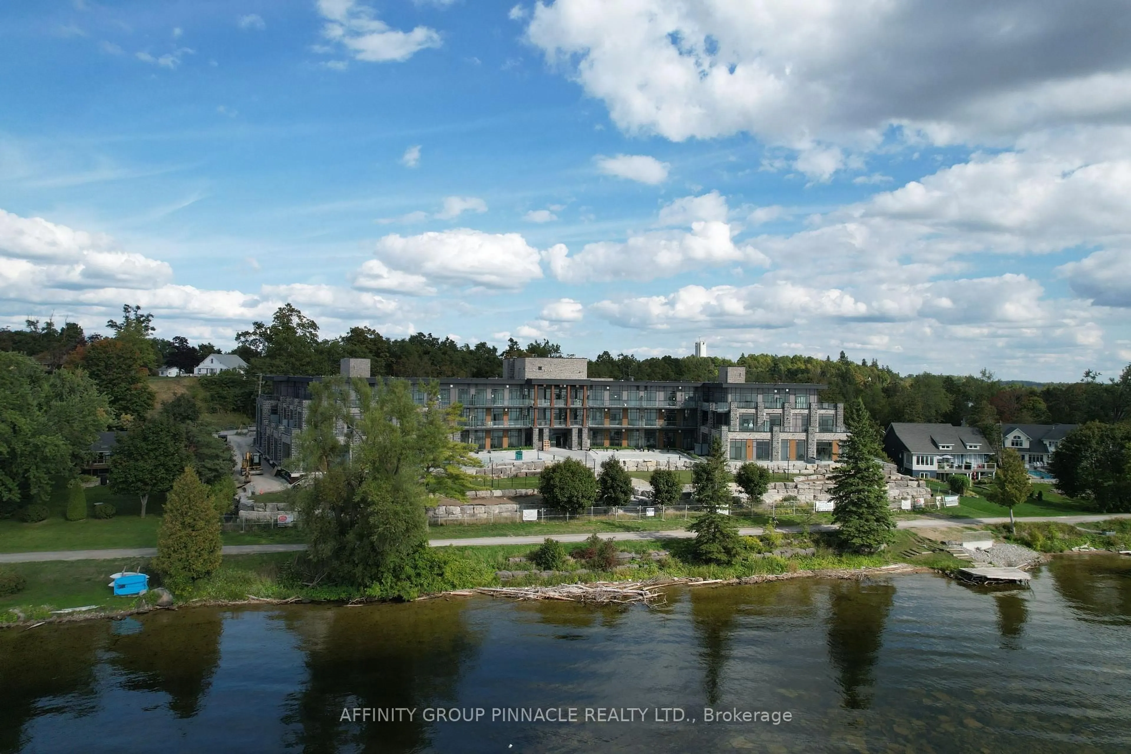 A pic from outside/outdoor area/front of a property/back of a property/a pic from drone, water/lake/river/ocean view for 99 Louisa St #201, Kawartha Lakes Ontario K0M 1N0