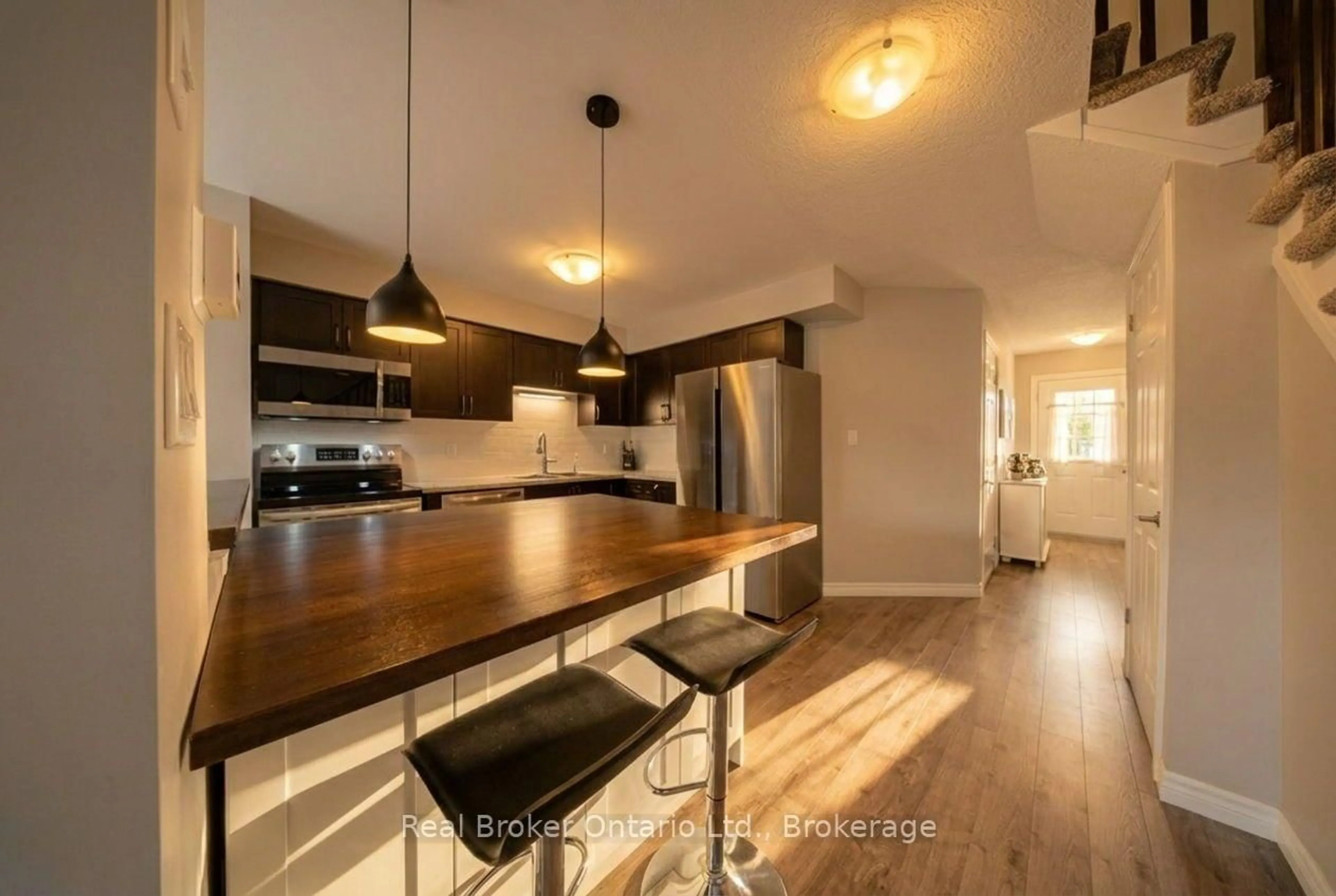 Open concept kitchen, wood/laminate floor for 30 Imperial Rd #21, Guelph Ontario N1K 1Y1