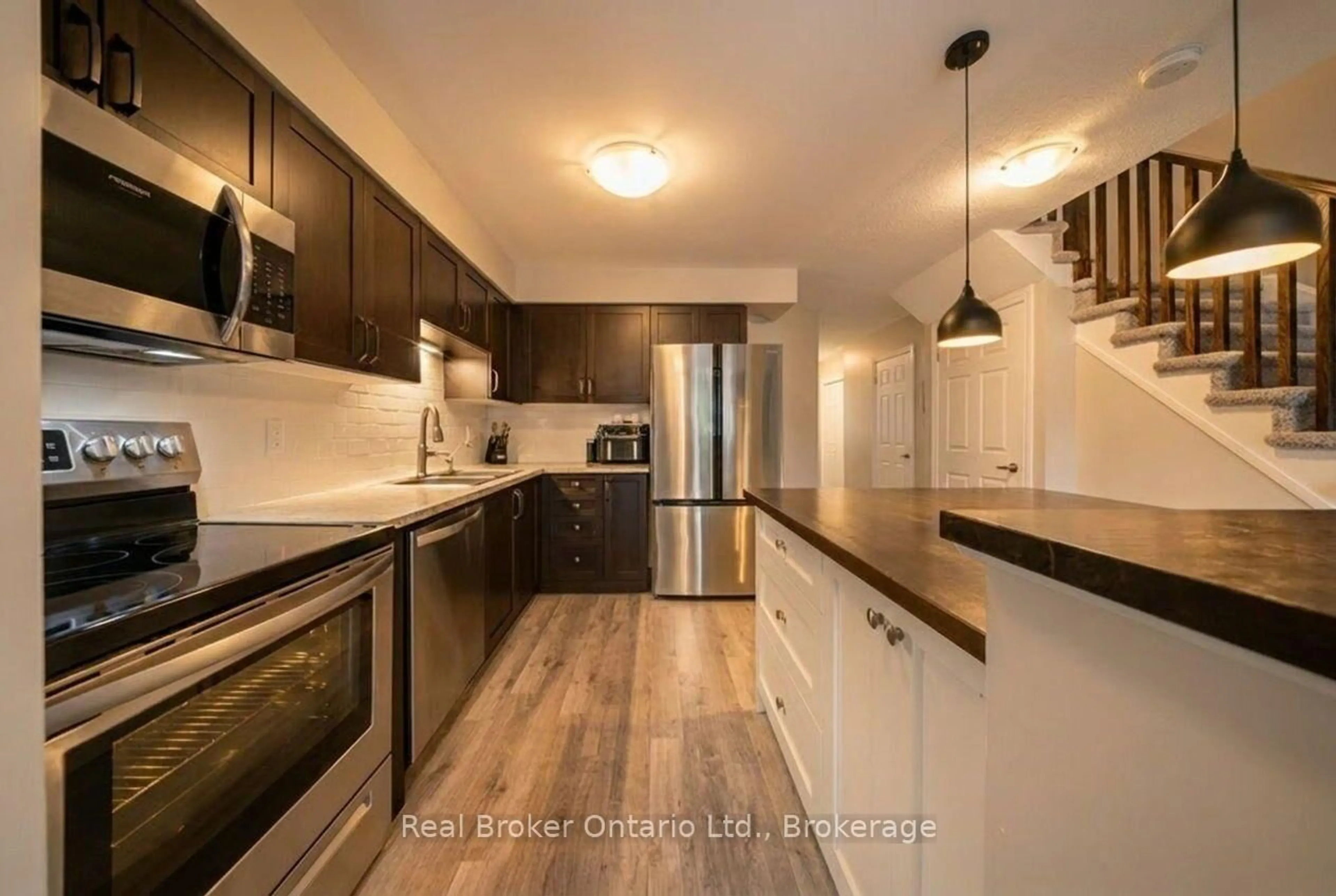Open concept kitchen, wood/laminate floor for 30 Imperial Rd #21, Guelph Ontario N1K 1Y1