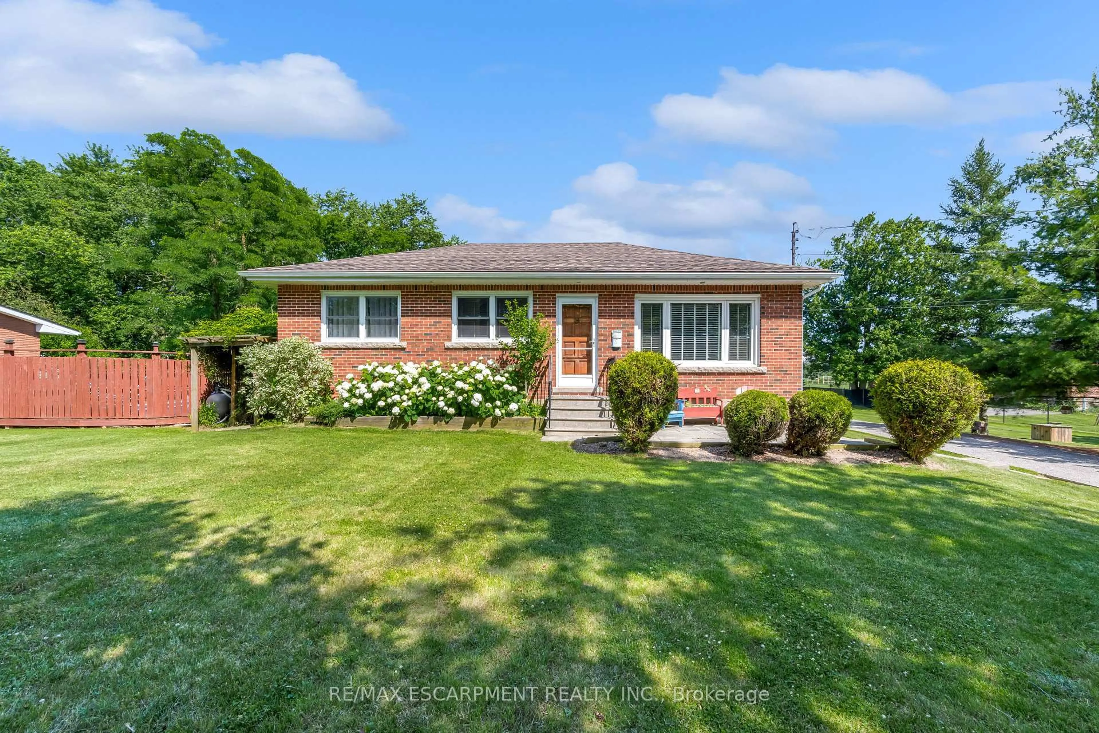 Home with brick exterior material, street for 1065 Woodburn Rd, Hamilton Ontario L0R 1P0