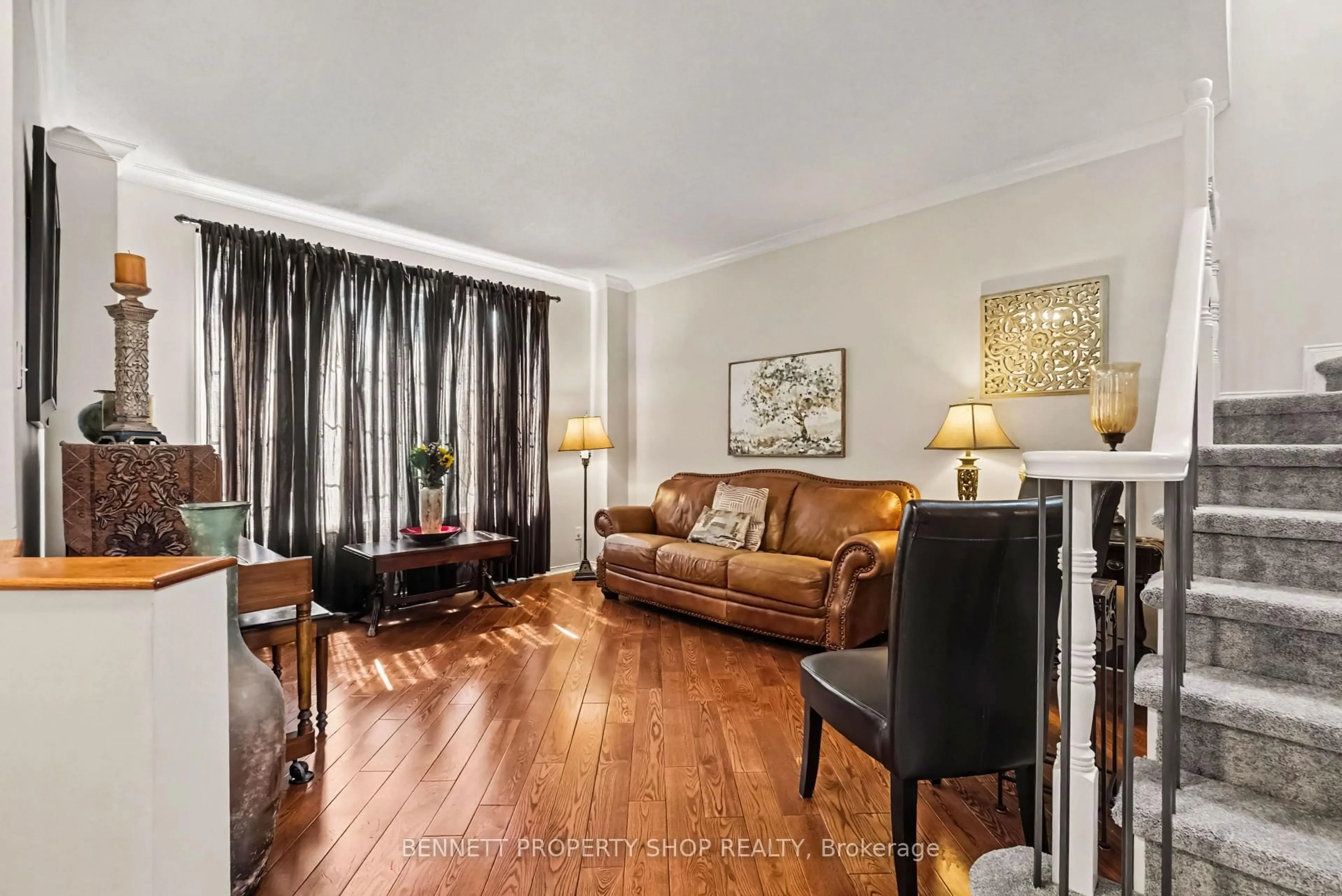 Living room with furniture, wood/laminate floor for 21 Summerwind Cres, Nepean Ontario K2G 6G6