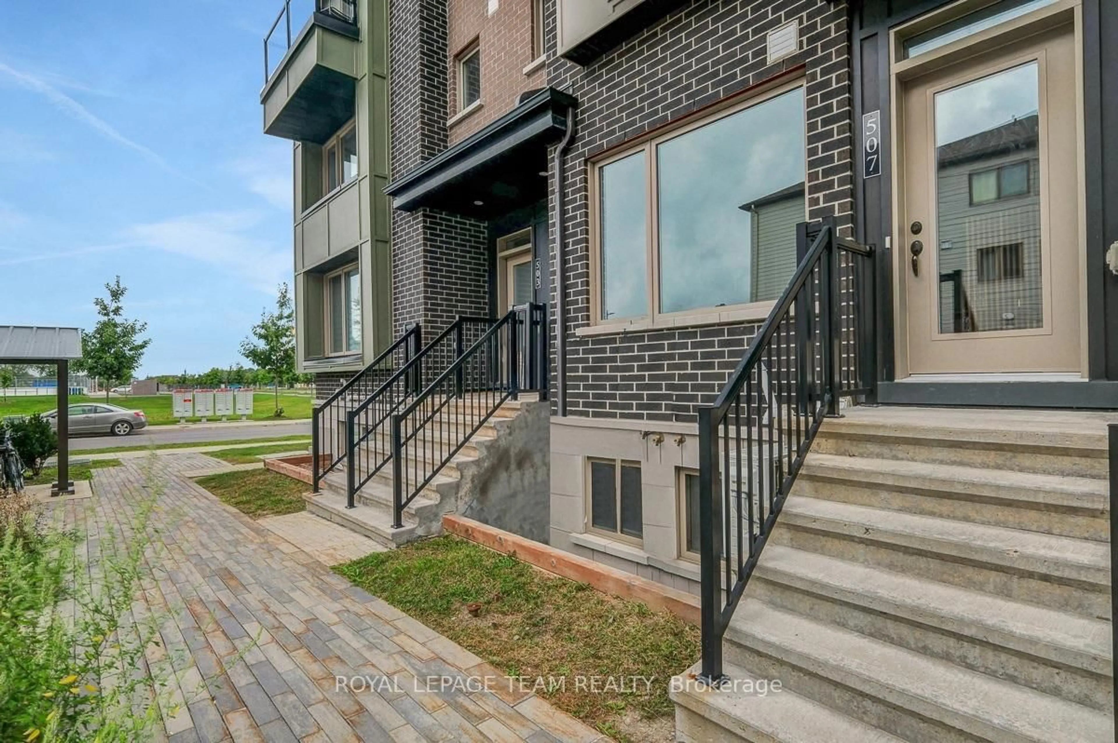 Home with brick exterior material, street for 507 Takamose Private, Ottawa Ontario K1K 5A5