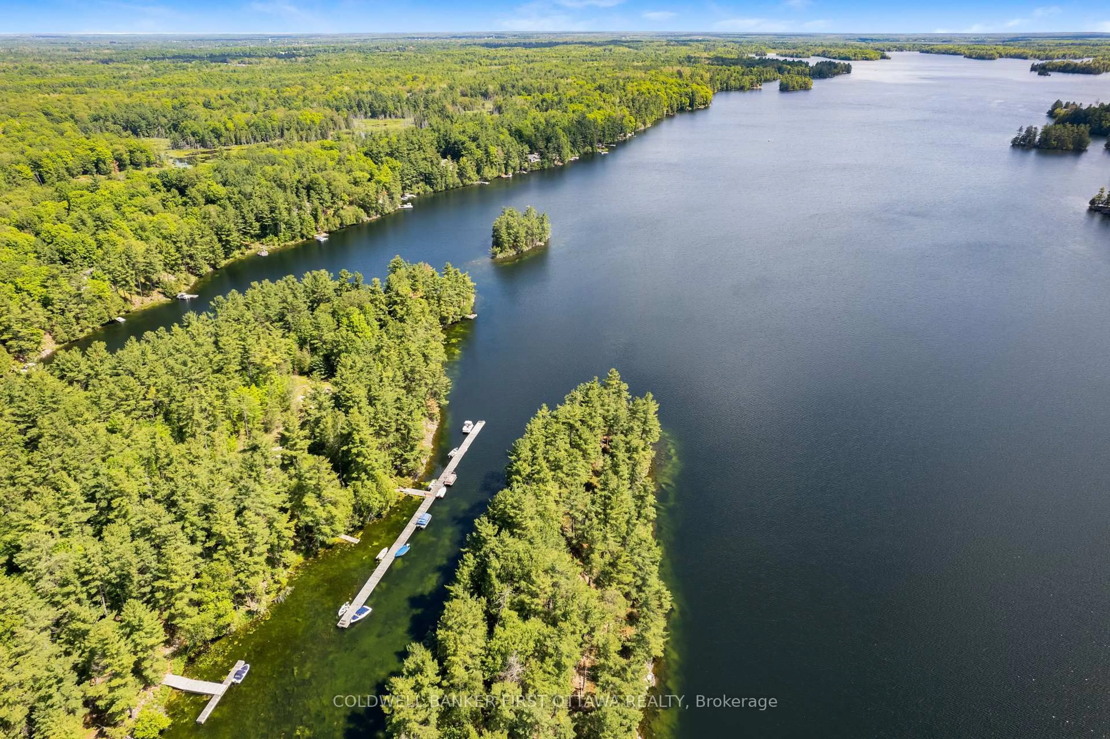 A pic from outside/outdoor area/front of a property/back of a property/a pic from drone, water/lake/river/ocean view for 944 McLaren Rd, Tay Valley Ontario K7H 0C9