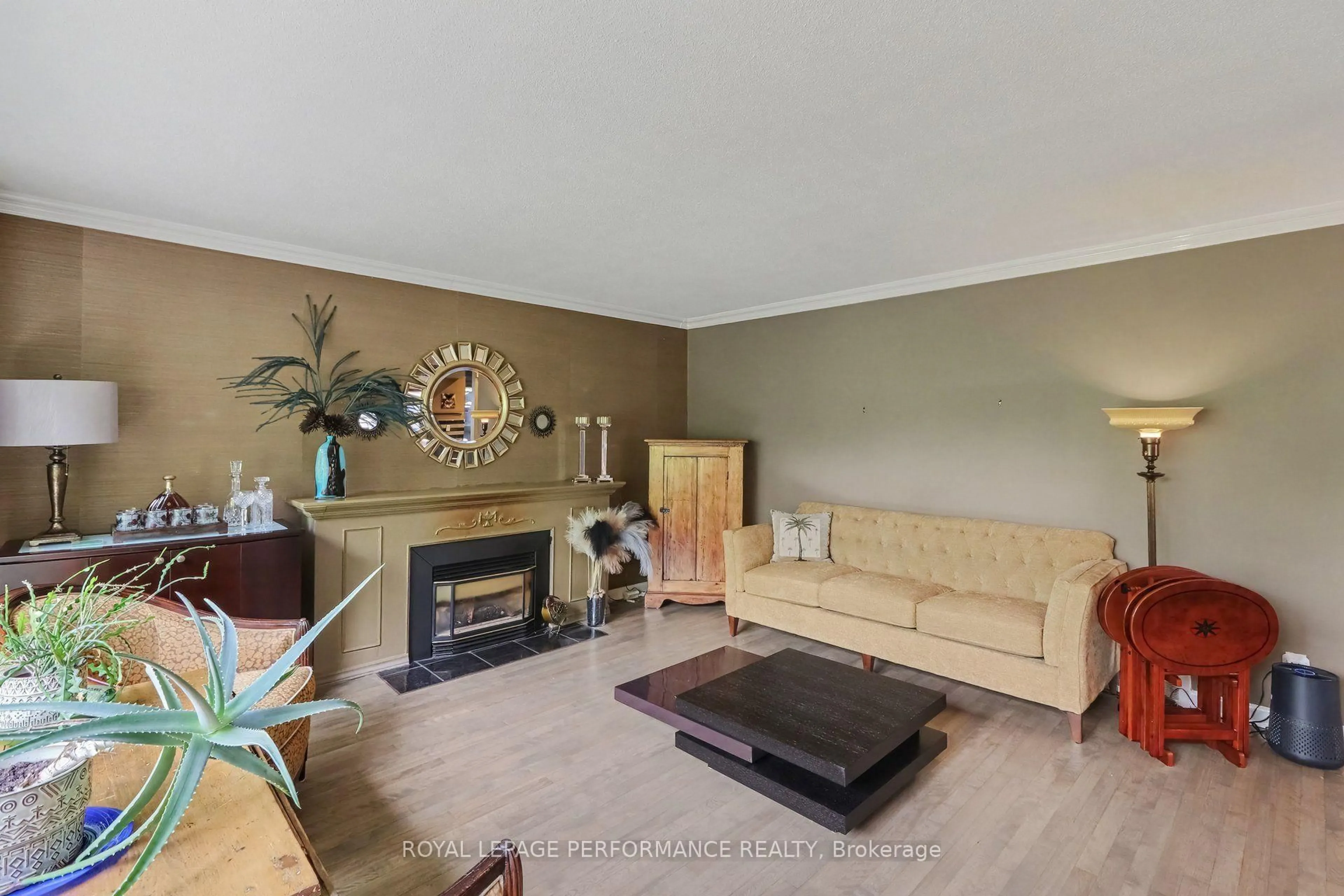 Living room with furniture, wood/laminate floor for 1147 Parkway Dr, Ottawa Ontario K2C 2W1
