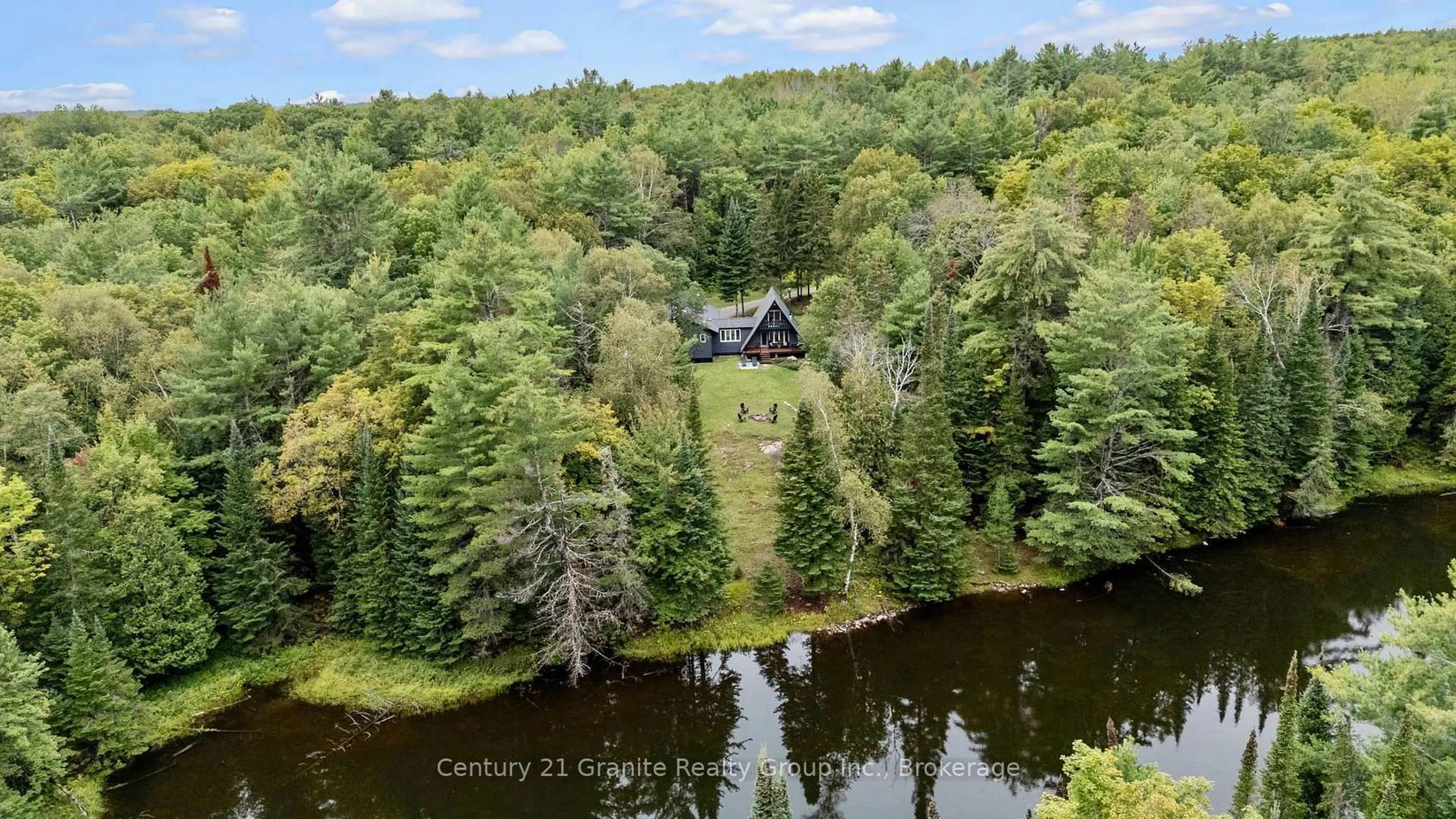 A pic from outside/outdoor area/front of a property/back of a property/a pic from drone, water/lake/river/ocean view for 1452 Blairhampton Rd, Minden Hills Ontario K0M 2K0