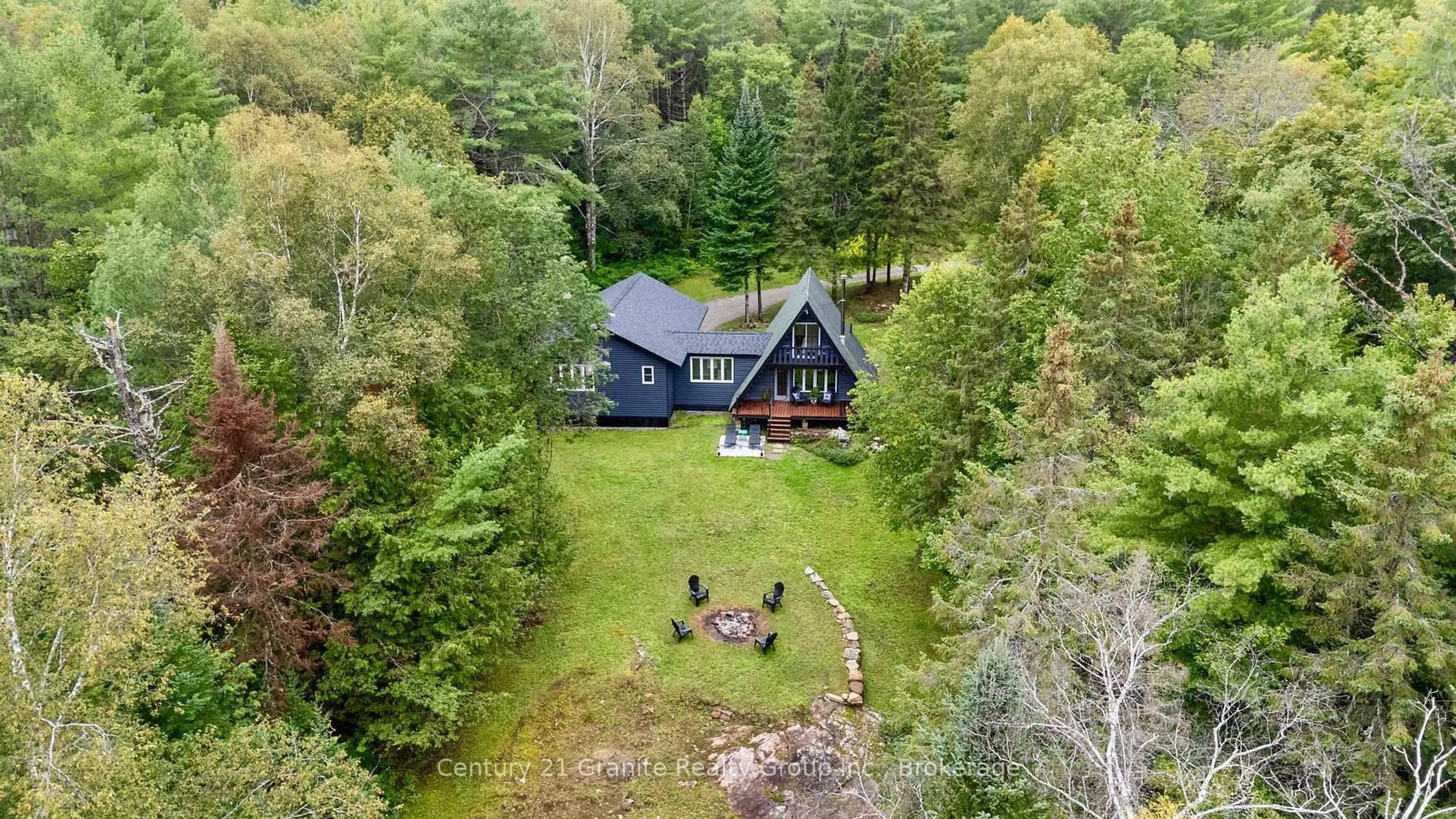 A pic from outside/outdoor area/front of a property/back of a property/a pic from drone, water/lake/river/ocean view for 1452 Blairhampton Rd, Minden Hills Ontario K0M 2K0