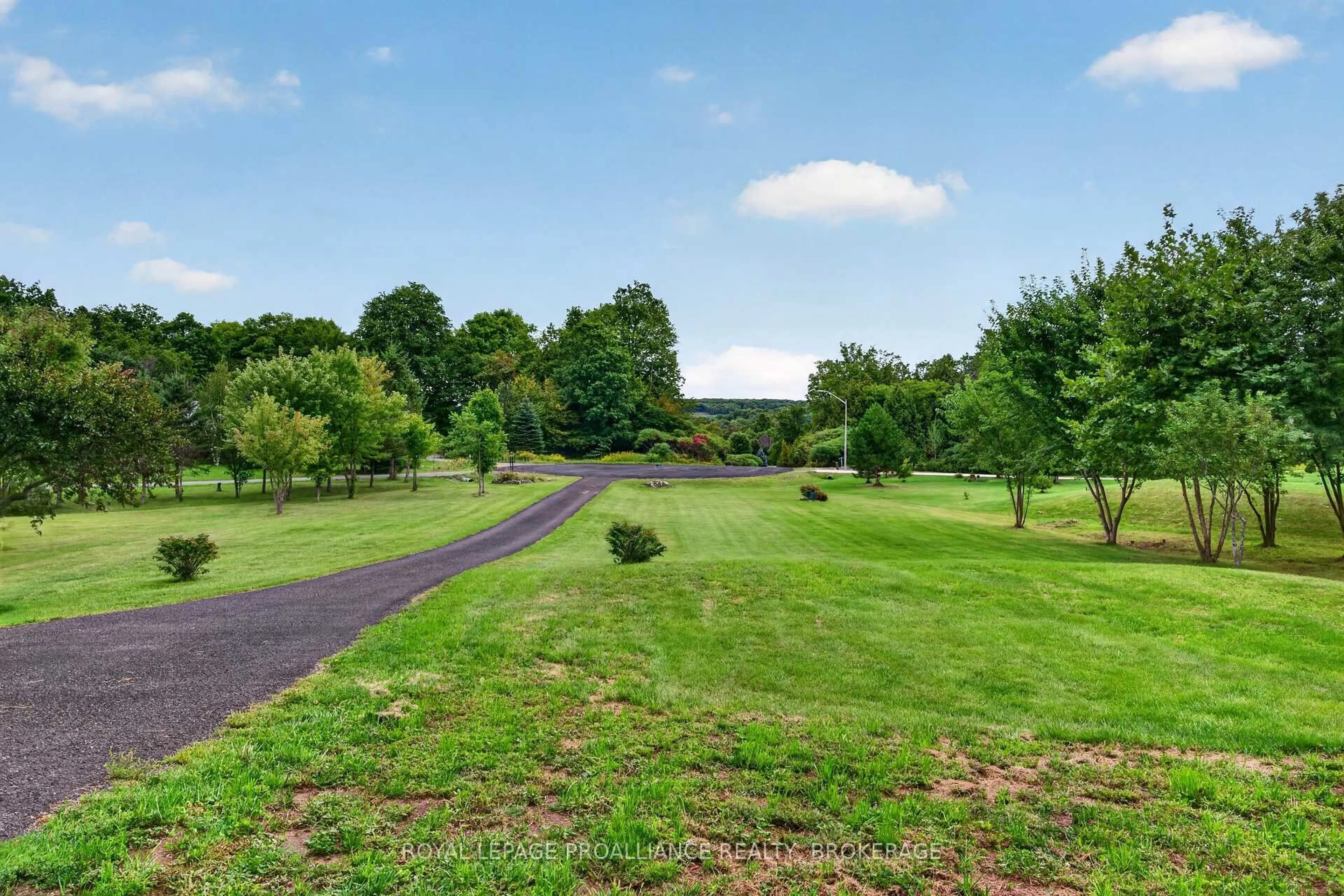 A pic from outside/outdoor area/front of a property/back of a property/a pic from drone, forest/trees view for 27 Collins Dr, Inverary Ontario K0H 1X0