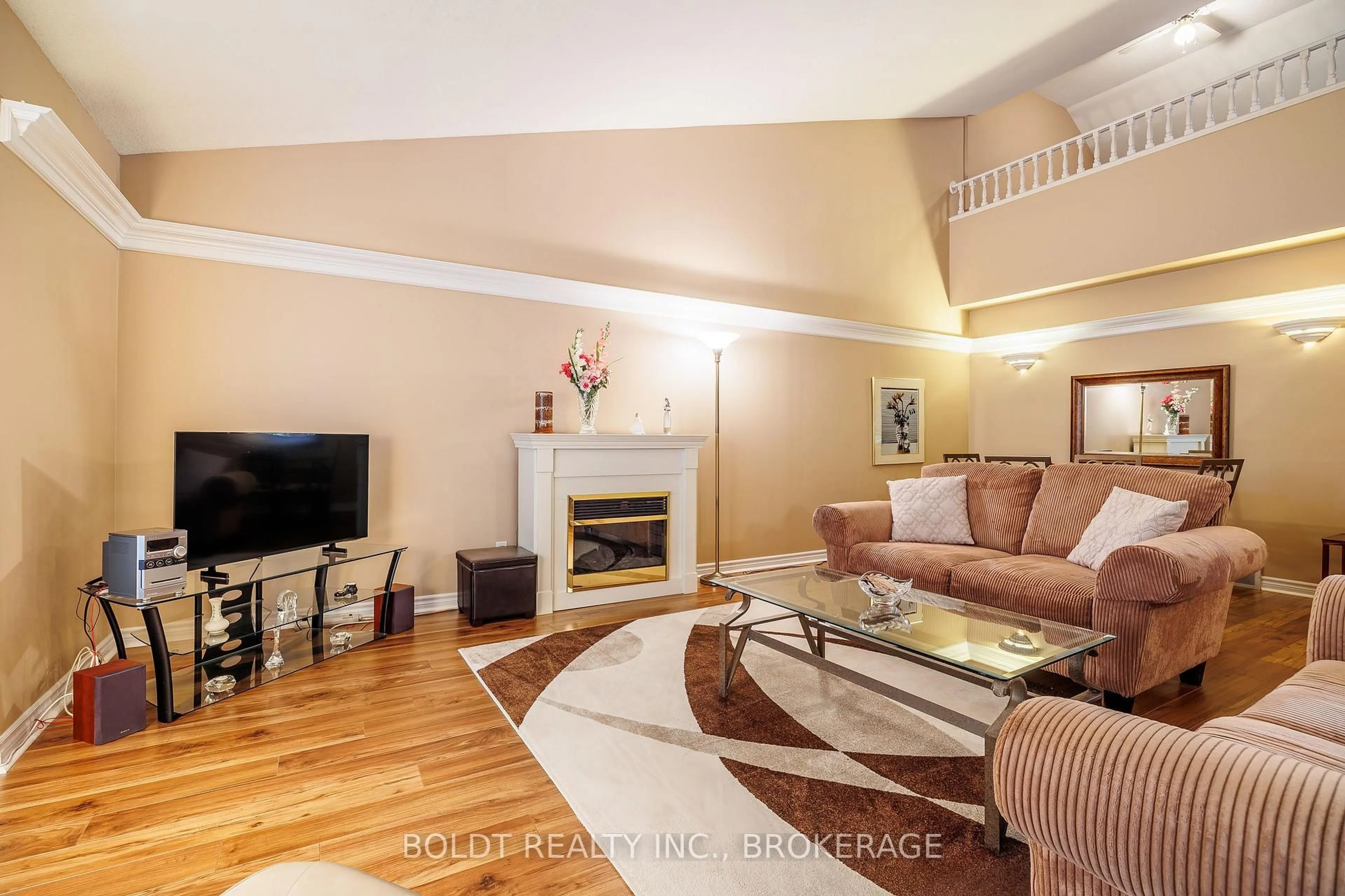 Living room with furniture, wood/laminate floor for 7370 Monastery Dr #10, Niagara Falls Ontario L2H 3C4