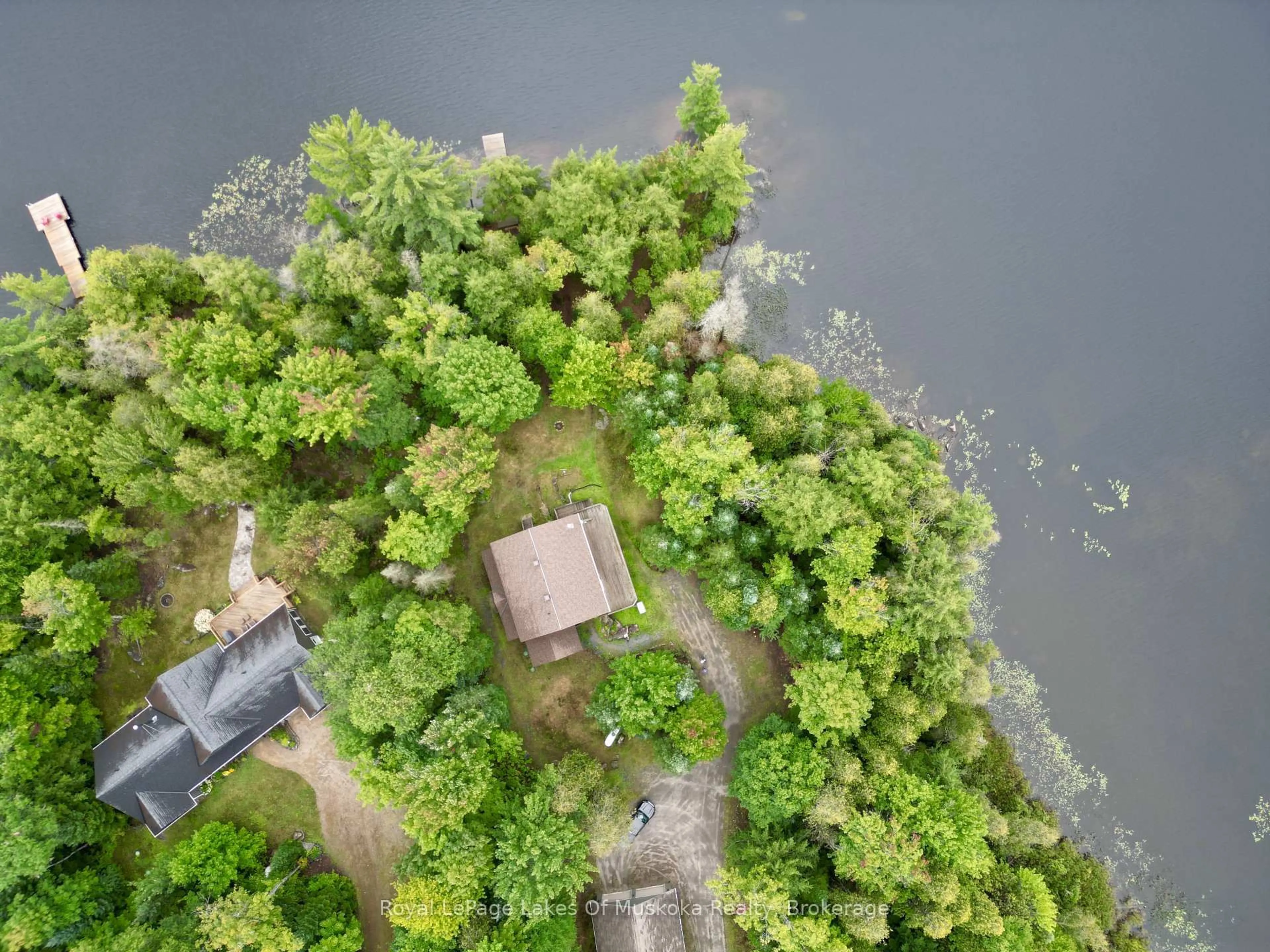 A pic from outside/outdoor area/front of a property/back of a property/a pic from drone, forest/trees view for 49 Wolf Tr #16, Perry Ontario P0A 1R0