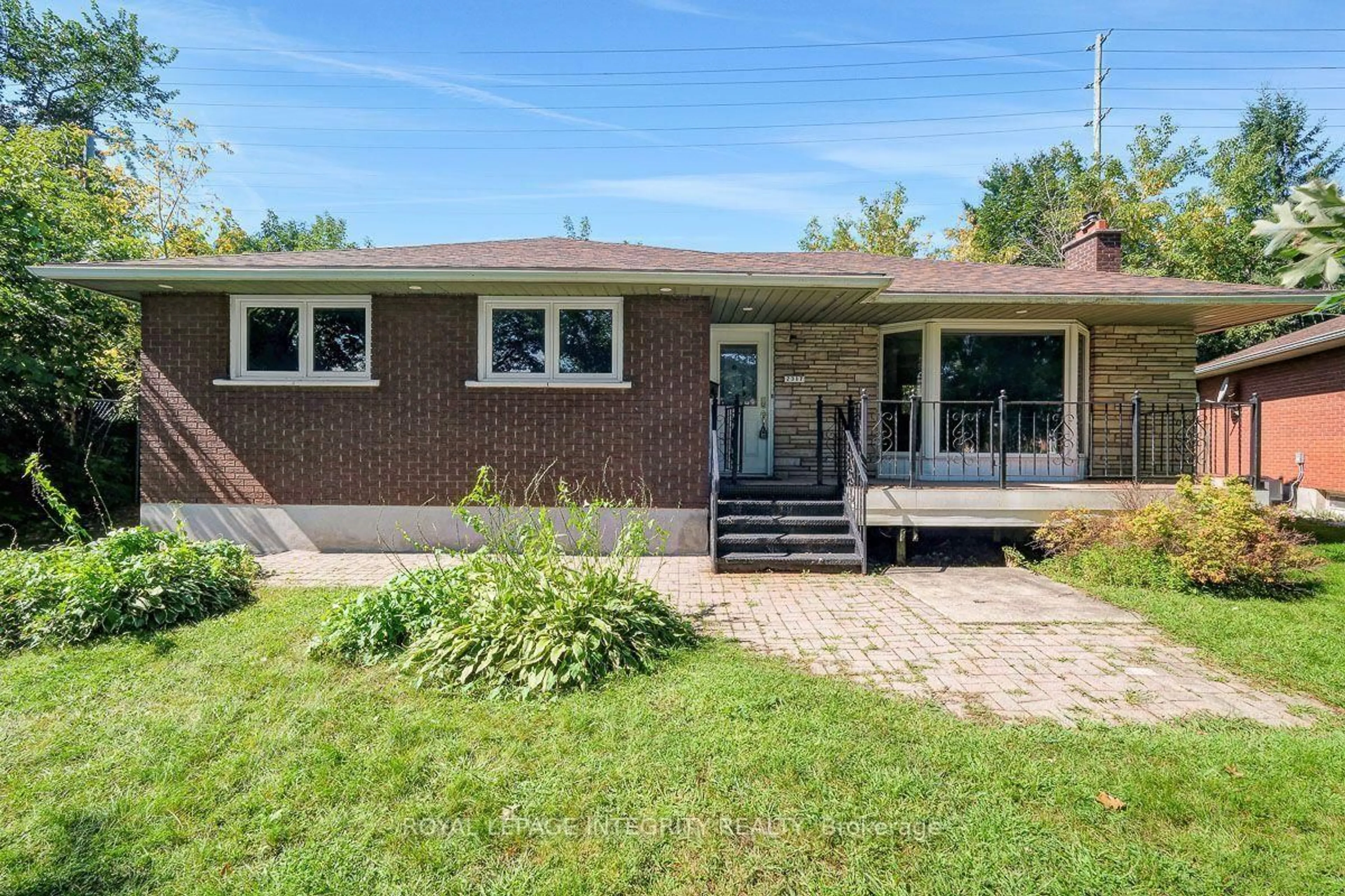 Home with brick exterior material, street for 2317 Elmira Dr, Ottawa Ontario K2C 1H3