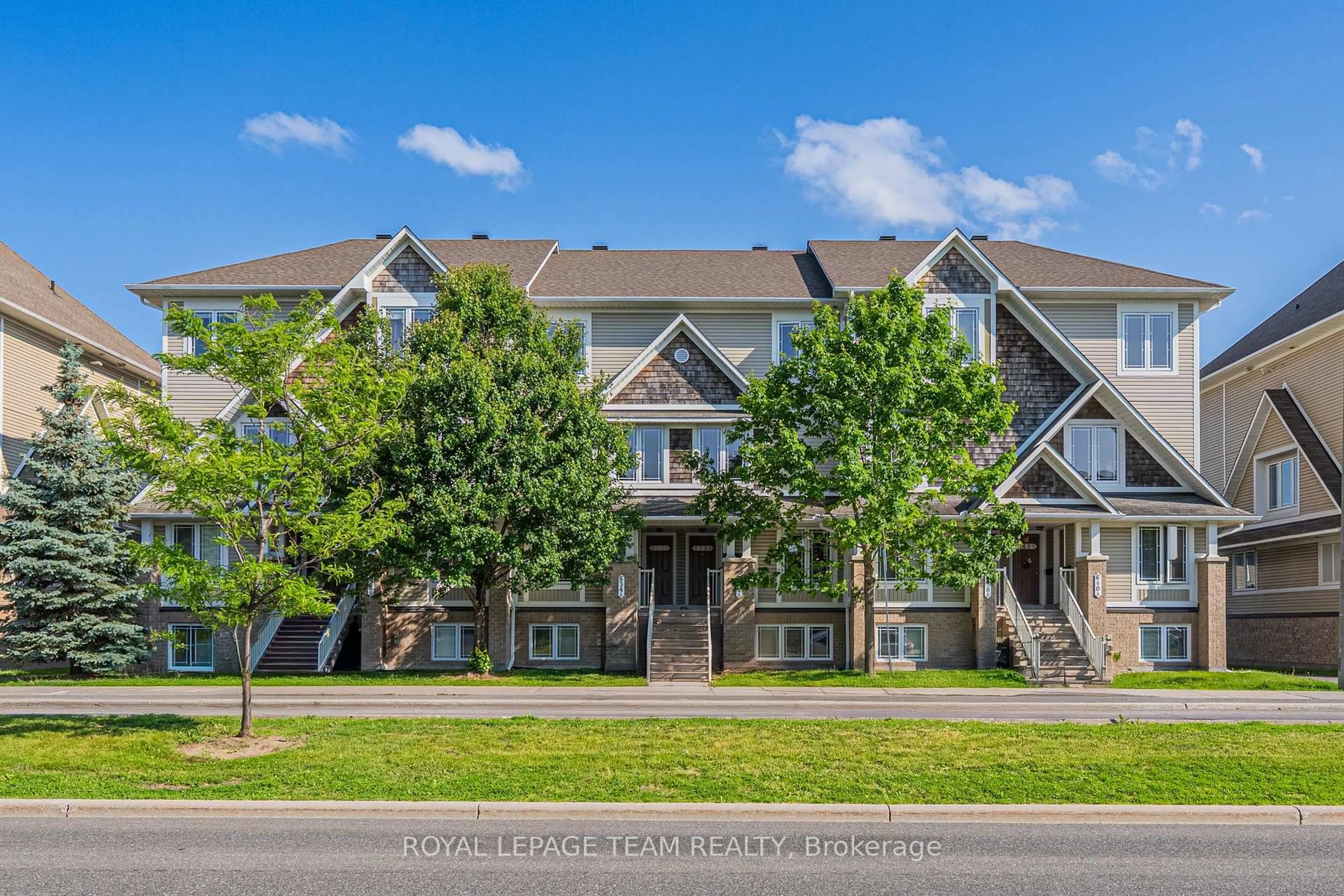A pic from outside/outdoor area/front of a property/back of a property/a pic from drone, unknown for 634 Chapman Mills Dr #B, Ottawa Ontario K2J 3V2