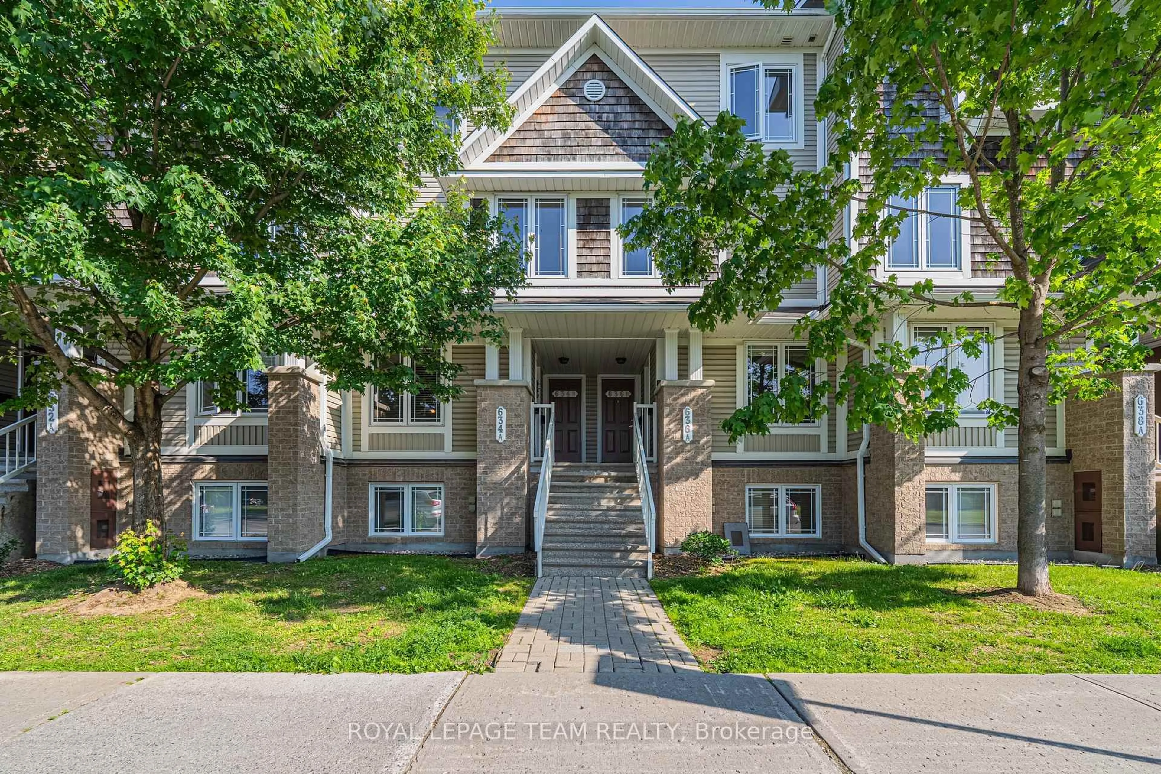 Home with brick exterior material, street for 634 Chapman Mills Dr #B, Ottawa Ontario K2J 3V2