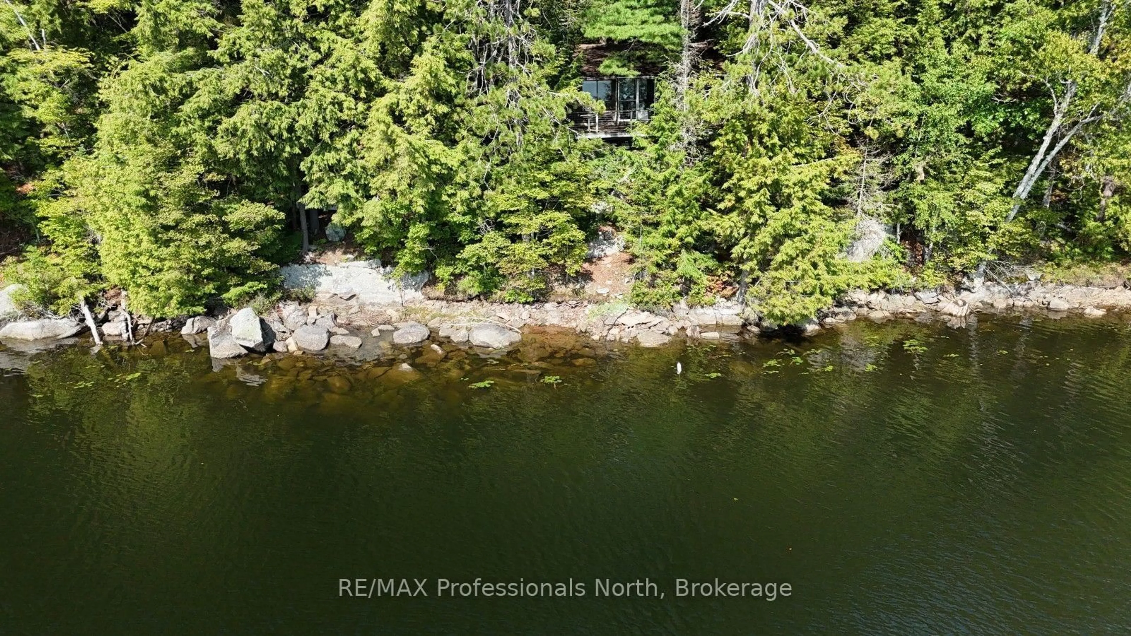 A pic from outside/outdoor area/front of a property/back of a property/a pic from drone, water/lake/river/ocean view for 1019 Arrowhead Dr, Highlands East Ontario K0M 1S0