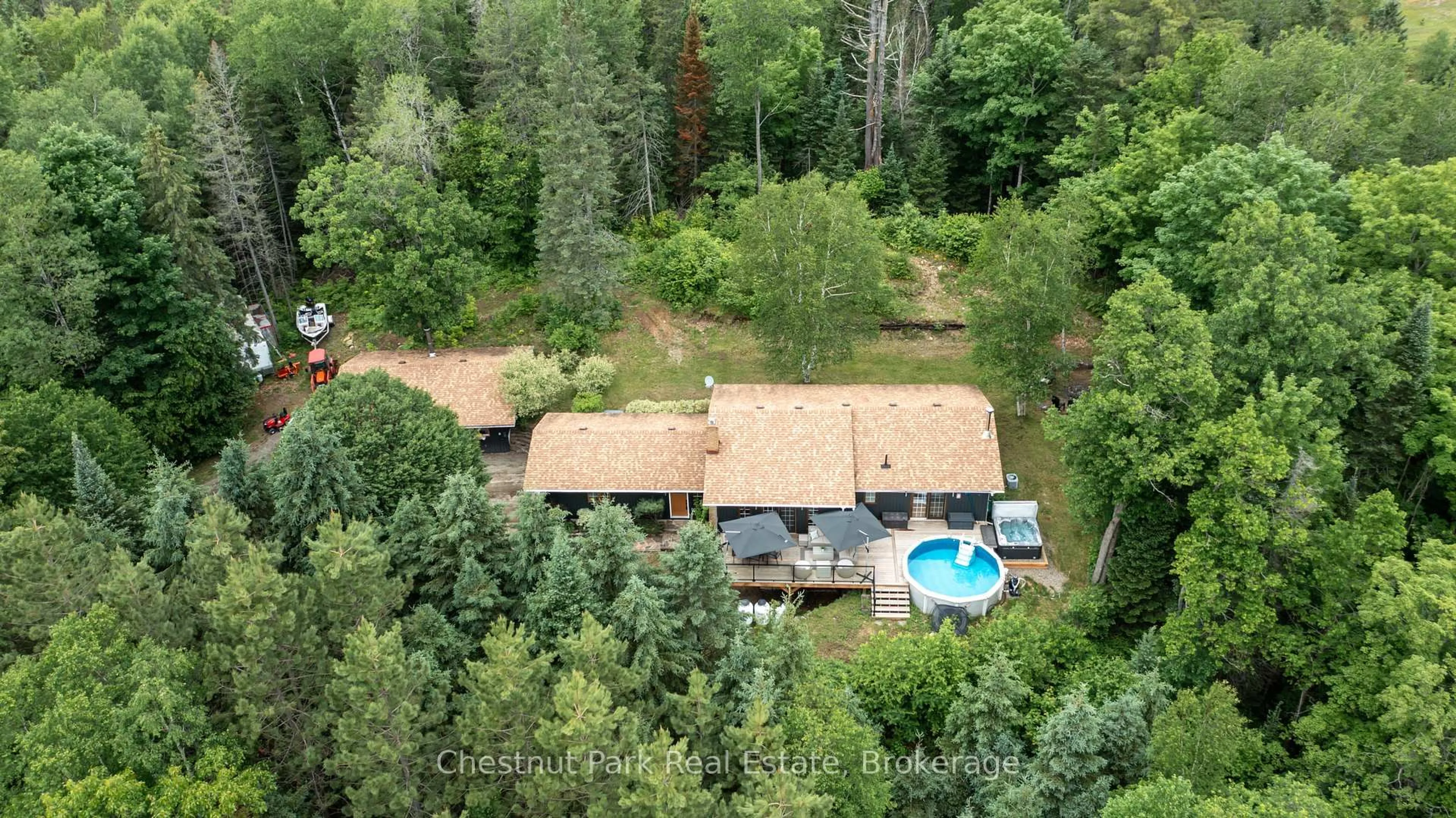 A pic from outside/outdoor area/front of a property/back of a property/a pic from drone, forest/trees view for 802 Williamsport Rd, Huntsville Ontario P1H 2J4