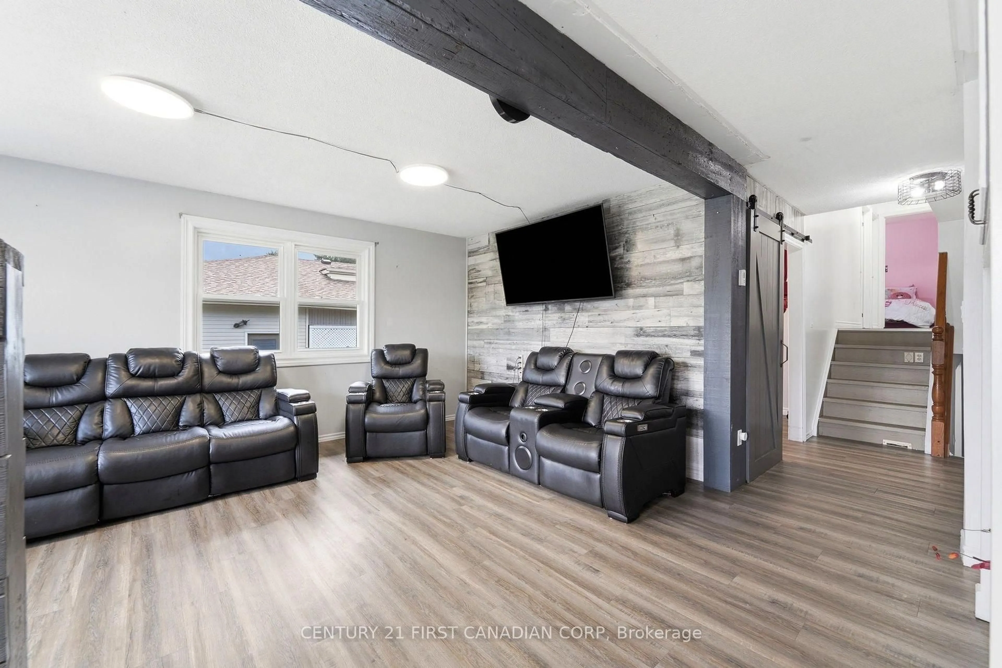 Living room with furniture, wood/laminate floor for 71 Edward St, Mapleton Ontario N0G 1P0